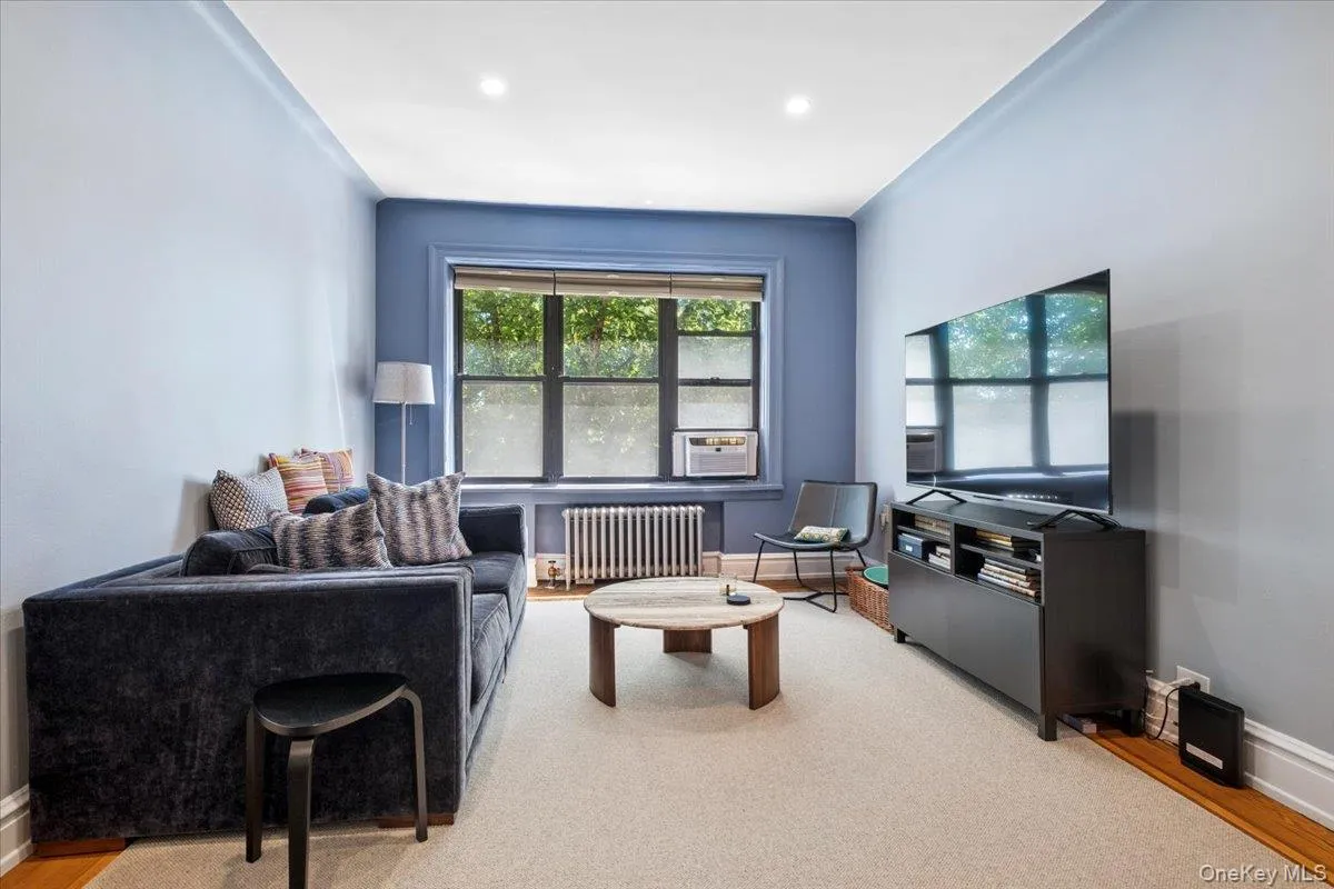Living Room has custom area carpets Living Room has custom area carpets