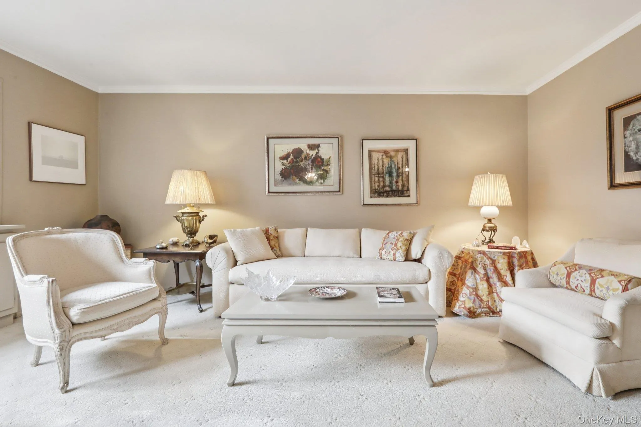 Carpeted living room featuring ornamental molding Carpeted living room featuring ornamental molding