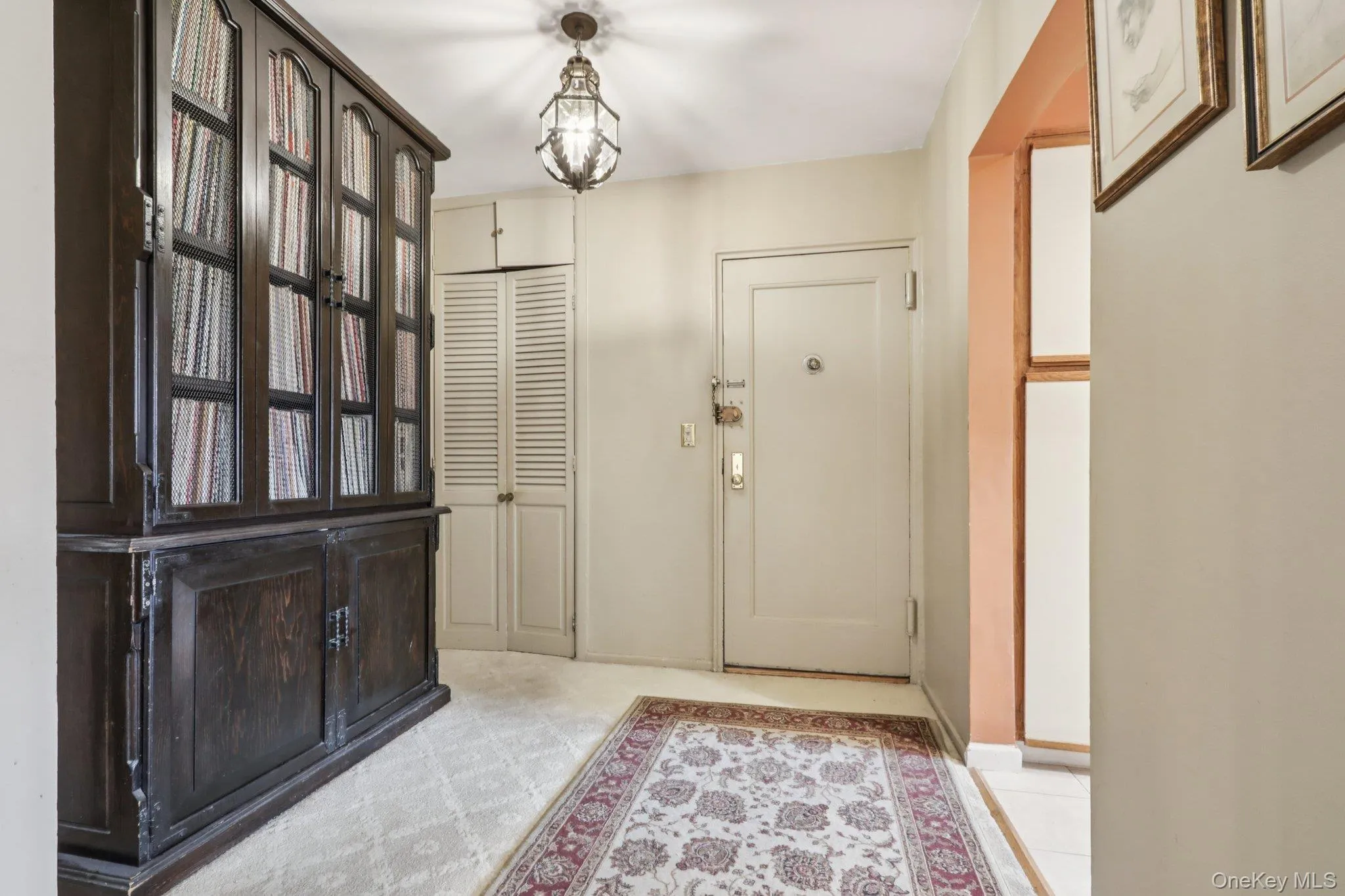 Entryway with a chandelier and baseboards Entryway with a chandelier and baseboards