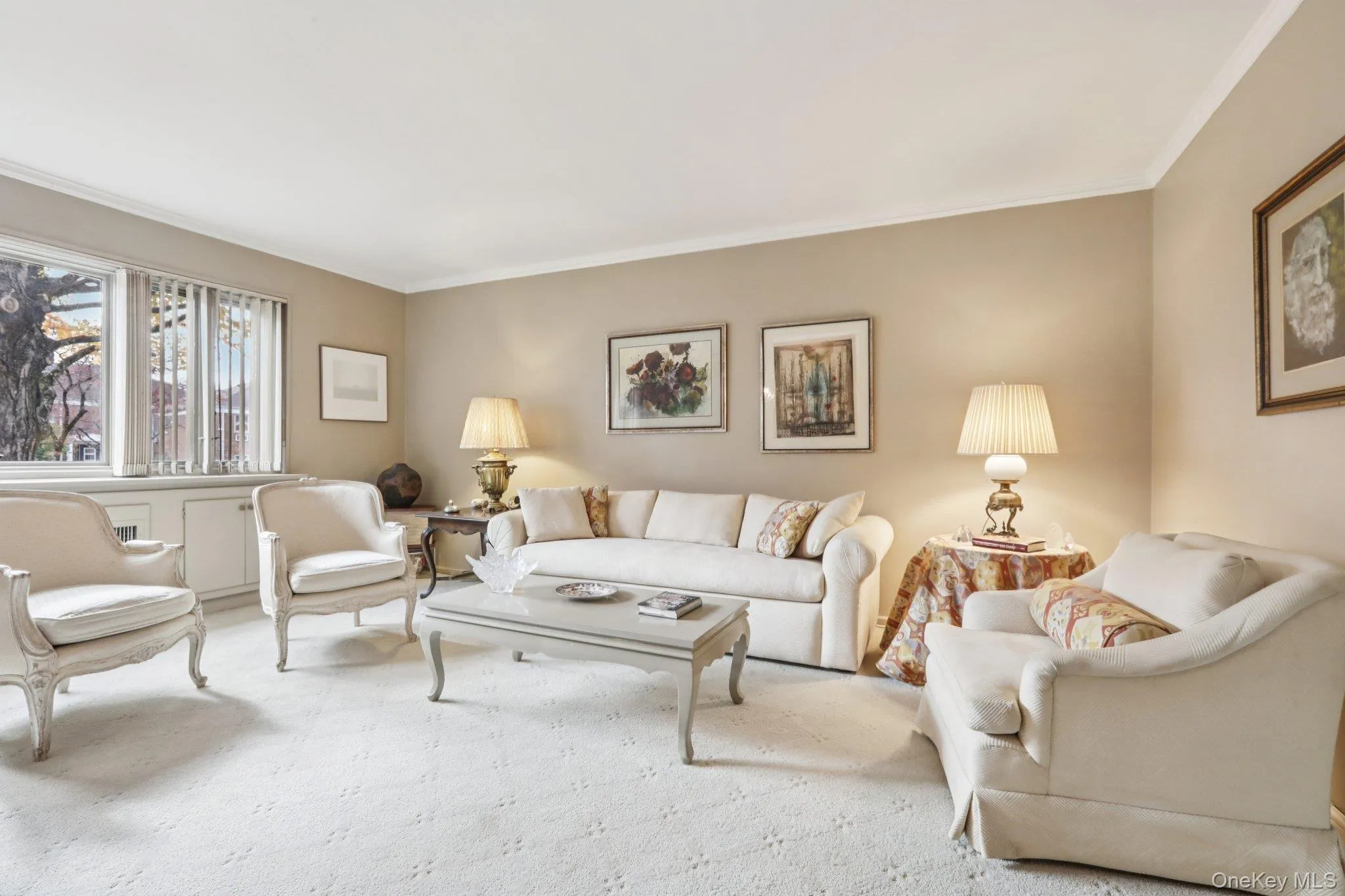 Carpeted living area with crown molding Carpeted living area with crown molding
