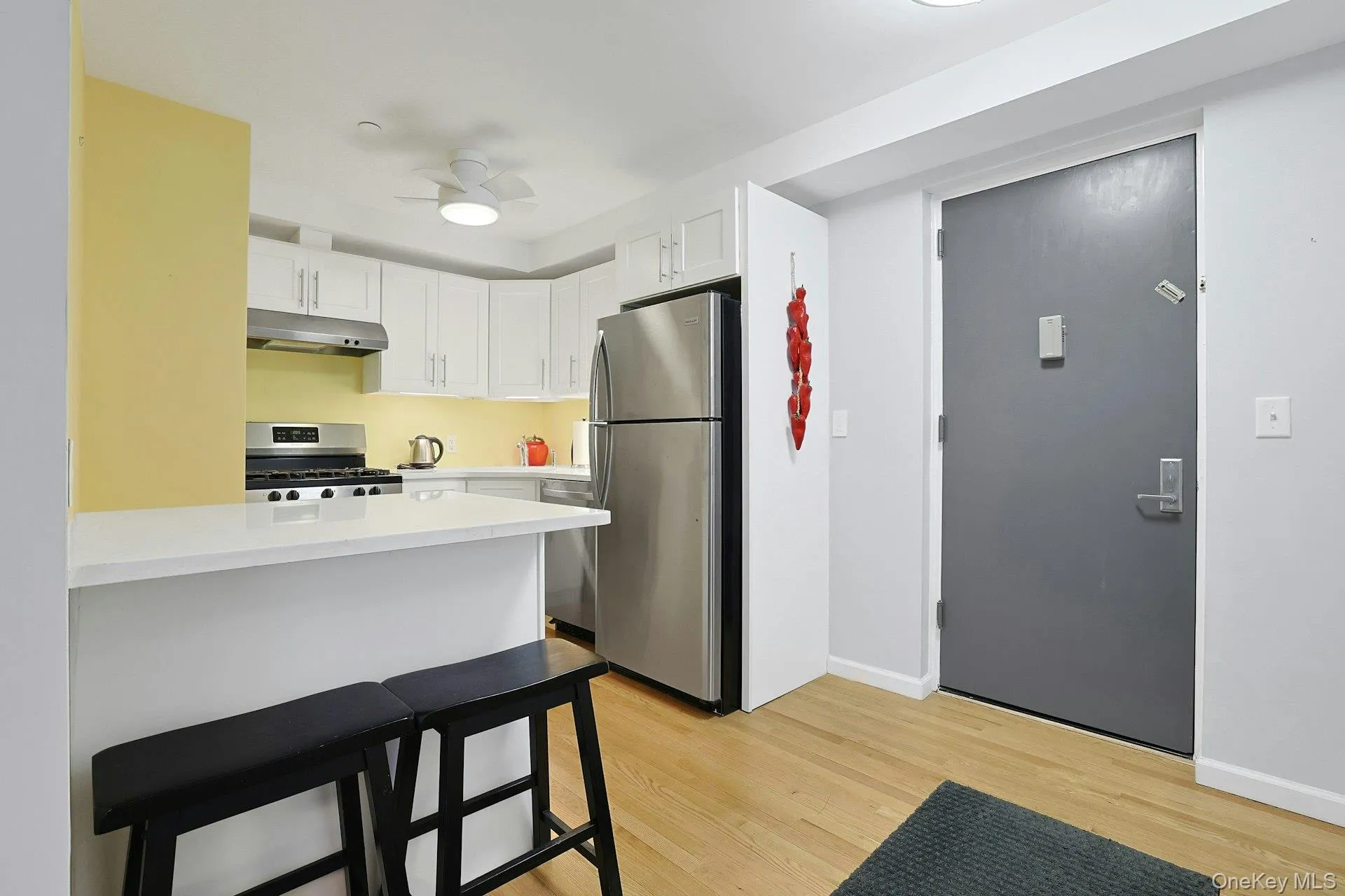View of kitchen from dining/living area. View of kitchen from dining/living area.