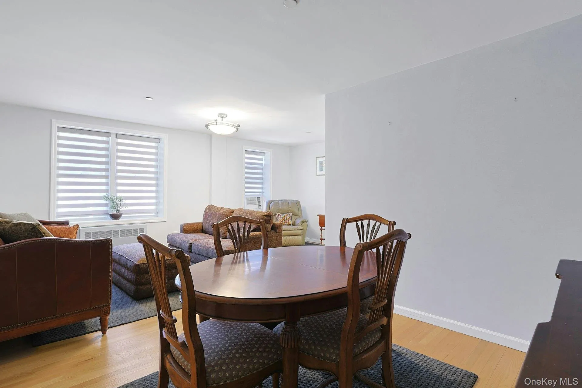 View from the dining area to the living room space. View from the dining area to the living room space.