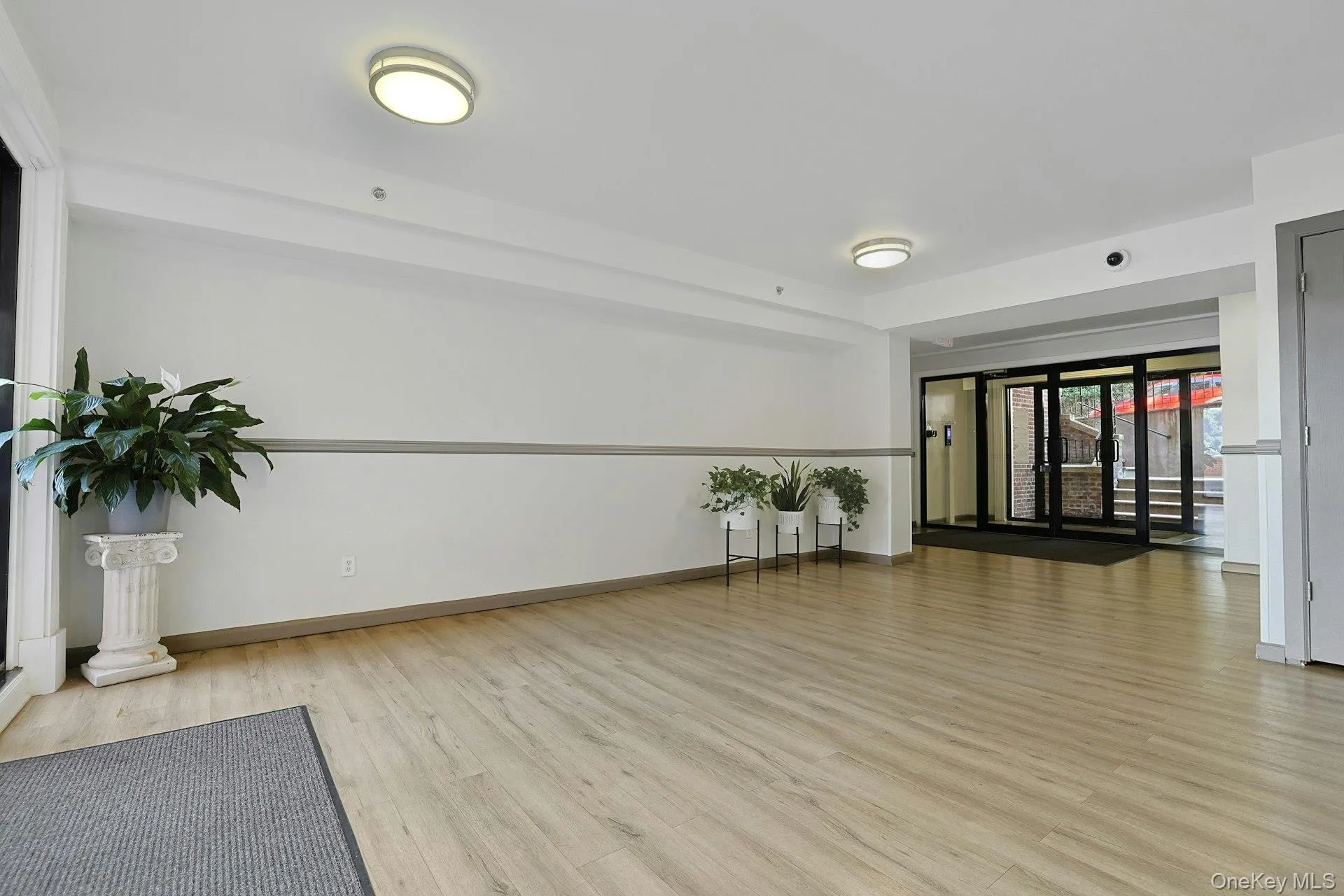 Entry opens to the foyer, mailboxes and package room. Entry opens to the foyer, mailboxes and package room.