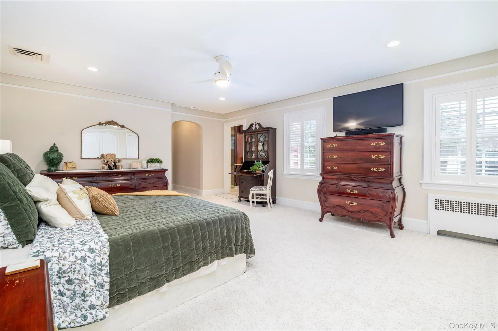 Spacious room featuring light-colored walls, recessed lighting, and a ceiling fan Spacious room featuring light-colored walls, recessed lighting, and a ceiling fan