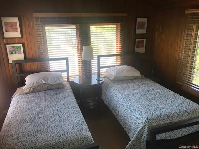 Bedroom with wooden walls Bedroom with wooden walls