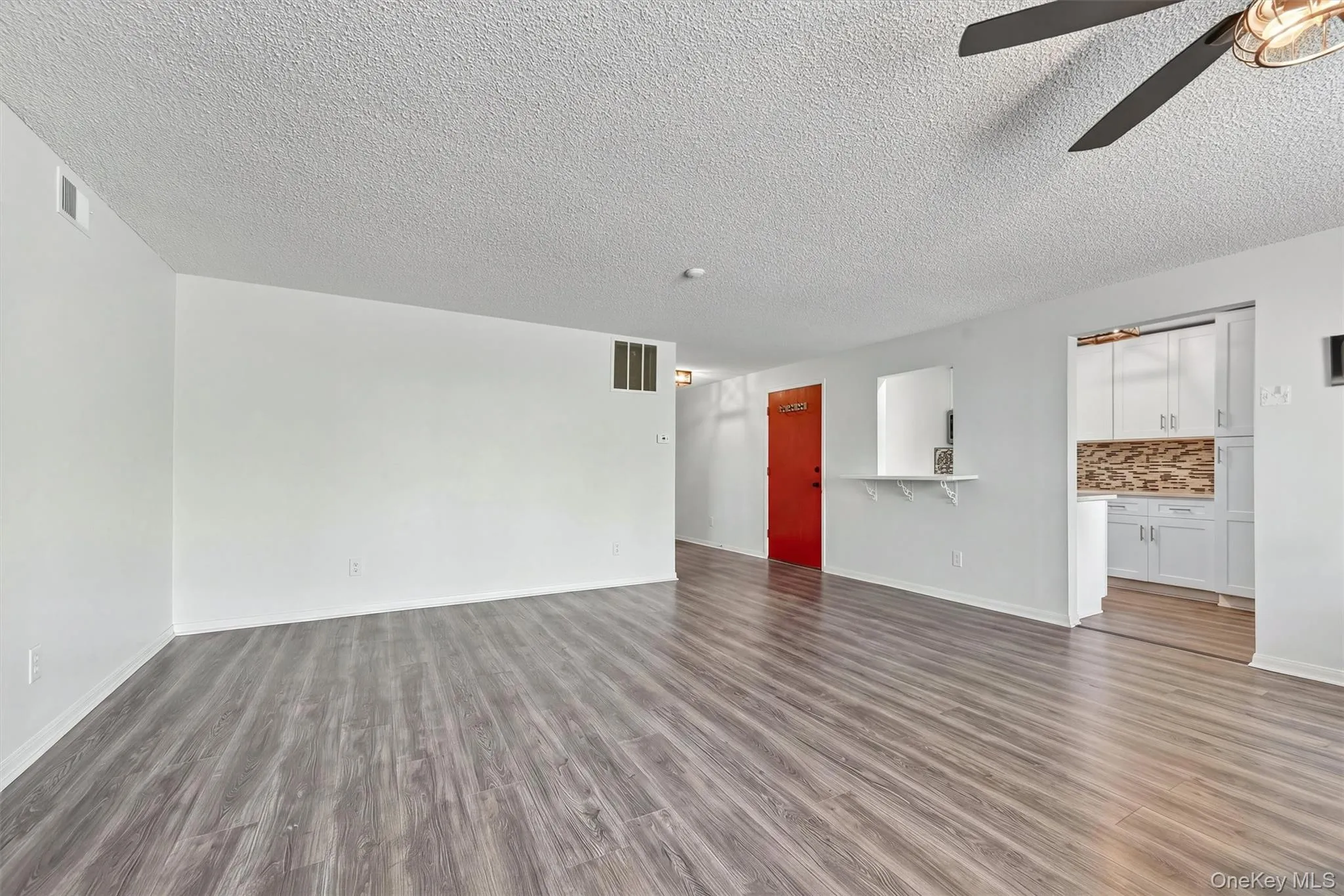 Living room to entry foyer. Living room to entry foyer.
