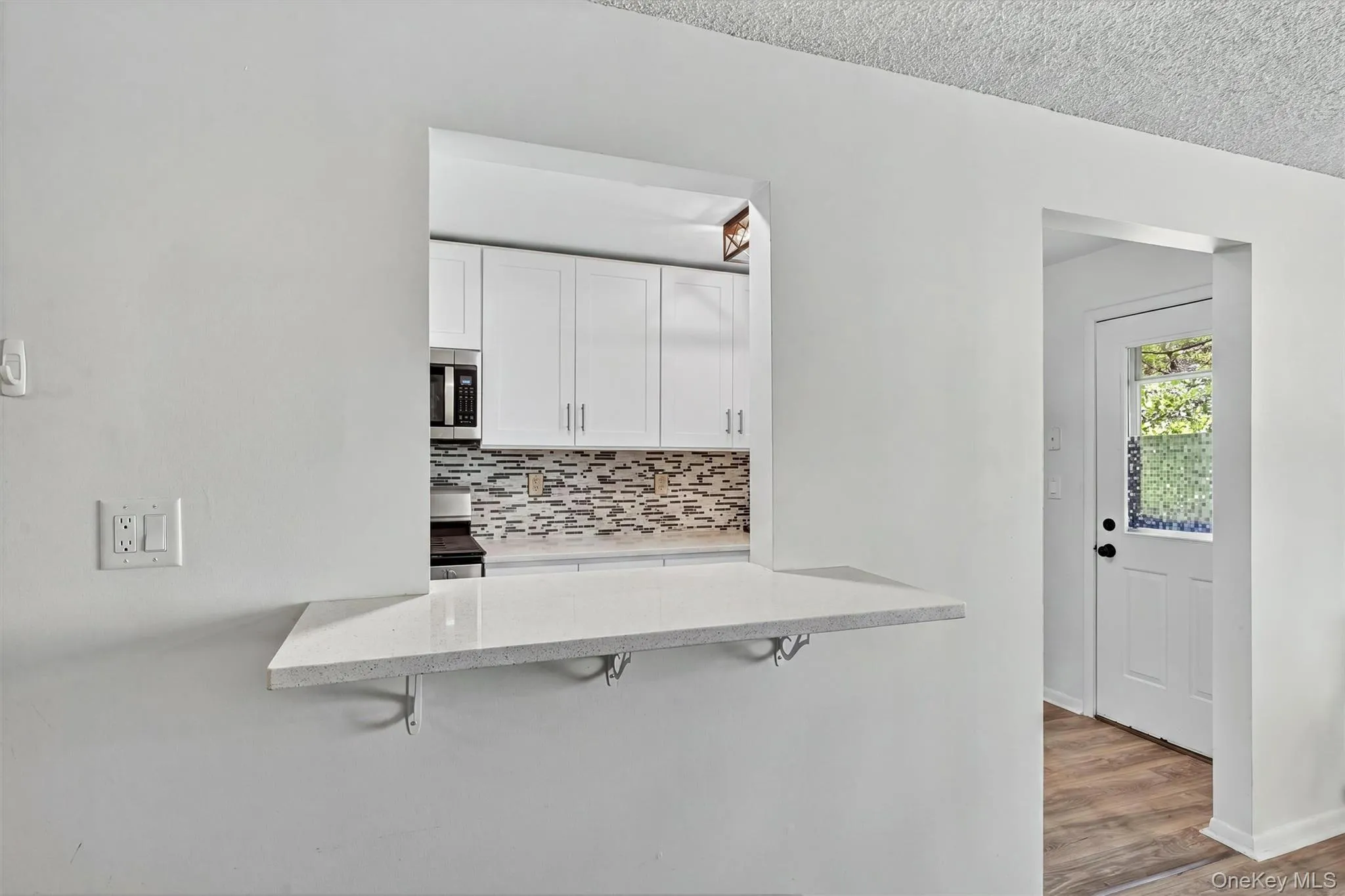 Countertop seating. Kitchen opens into the living room. Countertop seating. Kitchen opens into the living room.