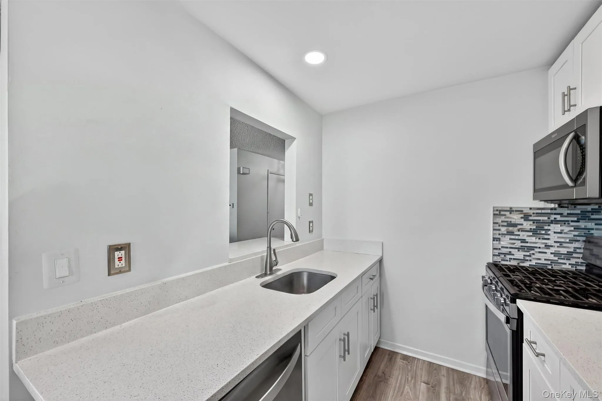 Kitchen opens to living room. Kitchen opens to living room.