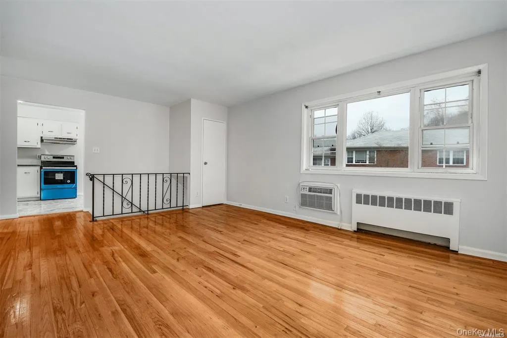Living Room with Coat Closet and Wall AC Living Room with Coat Closet and Wall AC