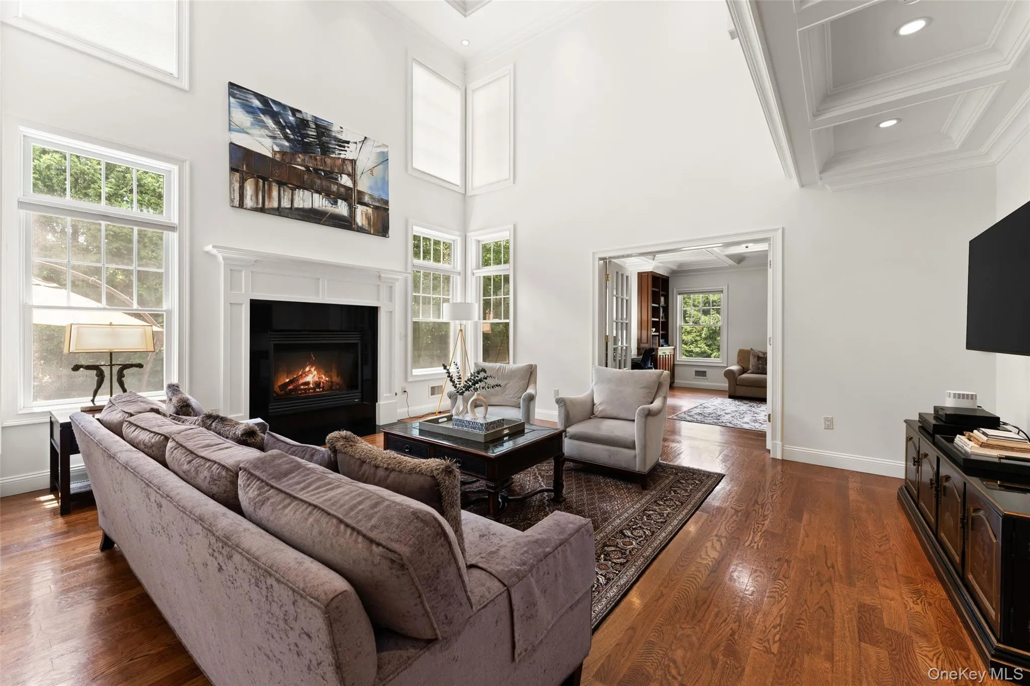 Family room with soaring two story ceilings and gas fire place Family room with soaring two story ceilings and gas fire place