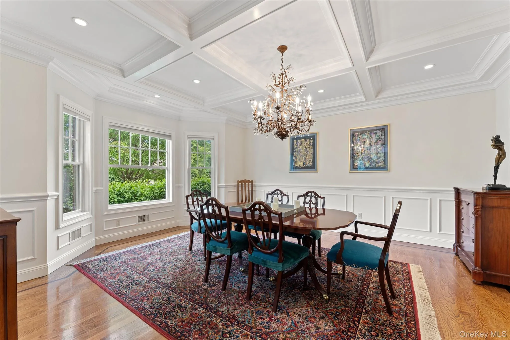 Dining Room with Coffered ceiling, recessed lighting and a large picture window Dining Room with Coffered ceiling, recessed lighting and a large picture window