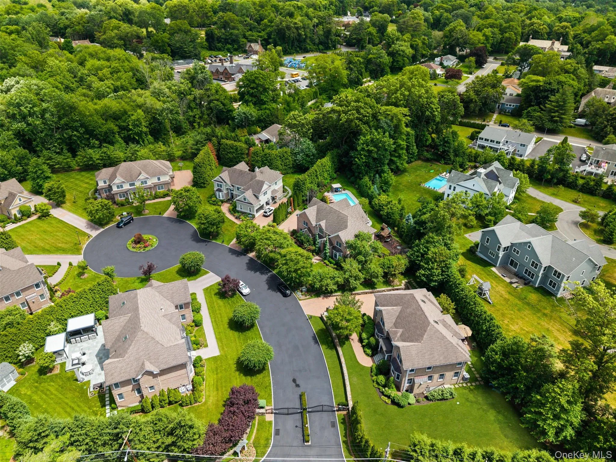 Aerial view of private street with gate Aerial view of private street with gate