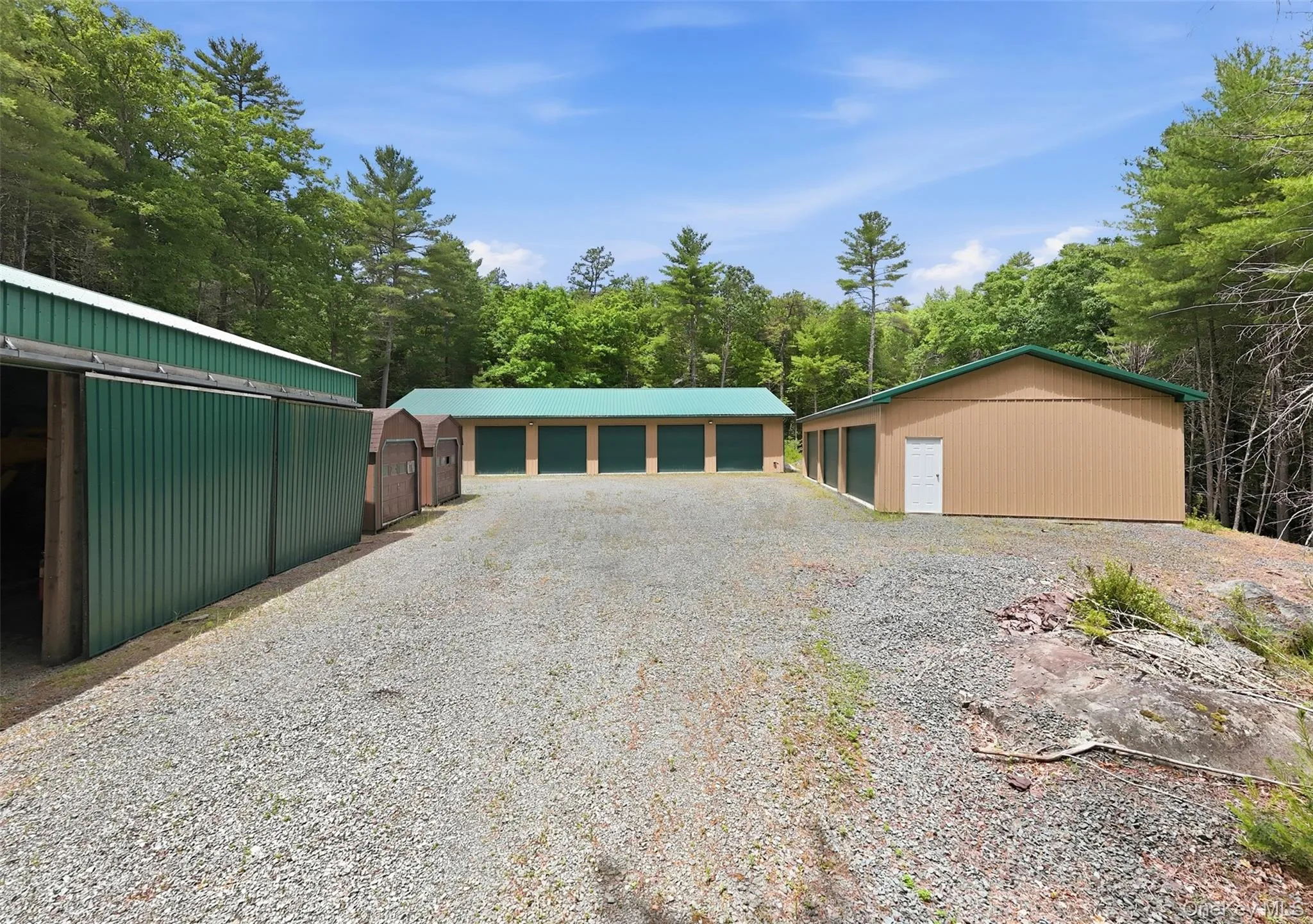 Two 6 Car Garages, Plus Additional Outbuildings Two 6 Car Garages, Plus Additional Outbuildings