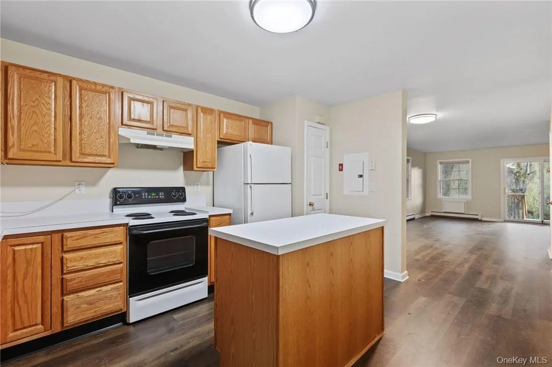 The kitchen has a pantry and opens to the living/dining areas The kitchen has a pantry and opens to the living/dining areas