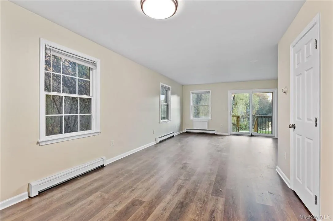 Open floor plan living area with laminate flooring Open floor plan living area with laminate flooring
