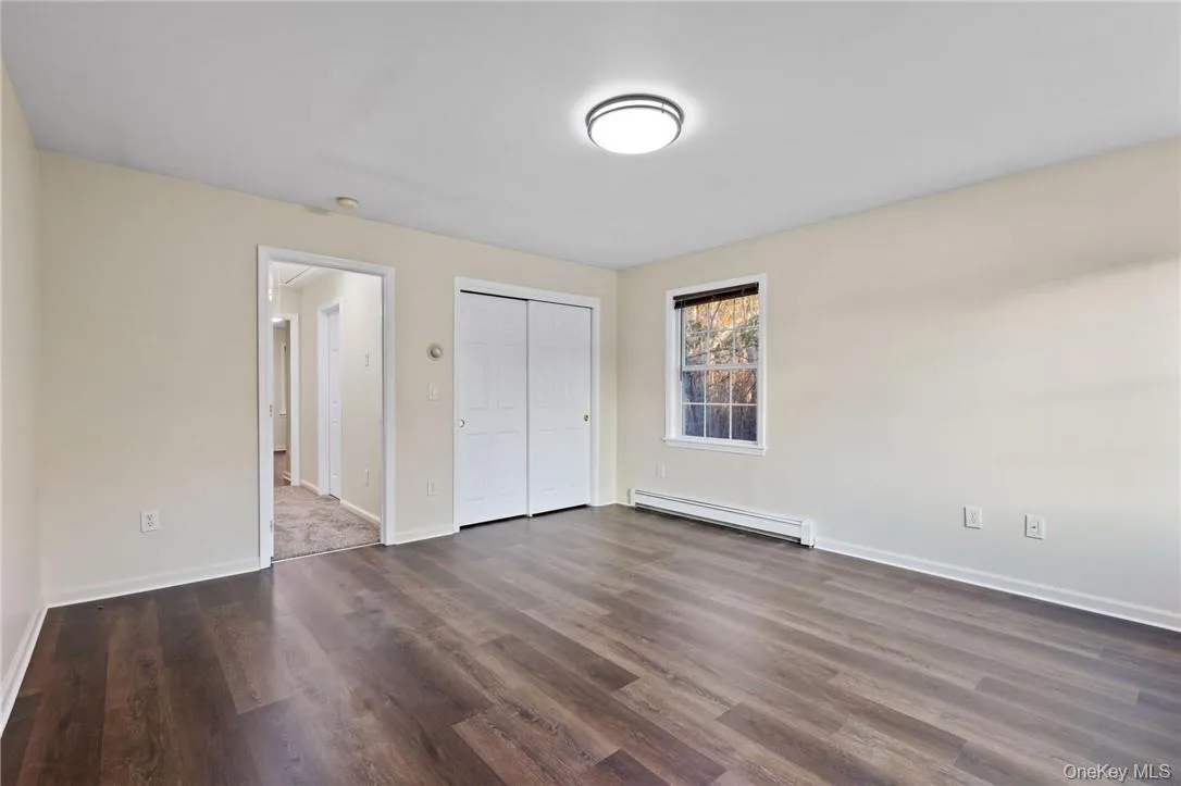 Upstairs bedroom is enhanced by laminate flooring Upstairs bedroom is enhanced by laminate flooring