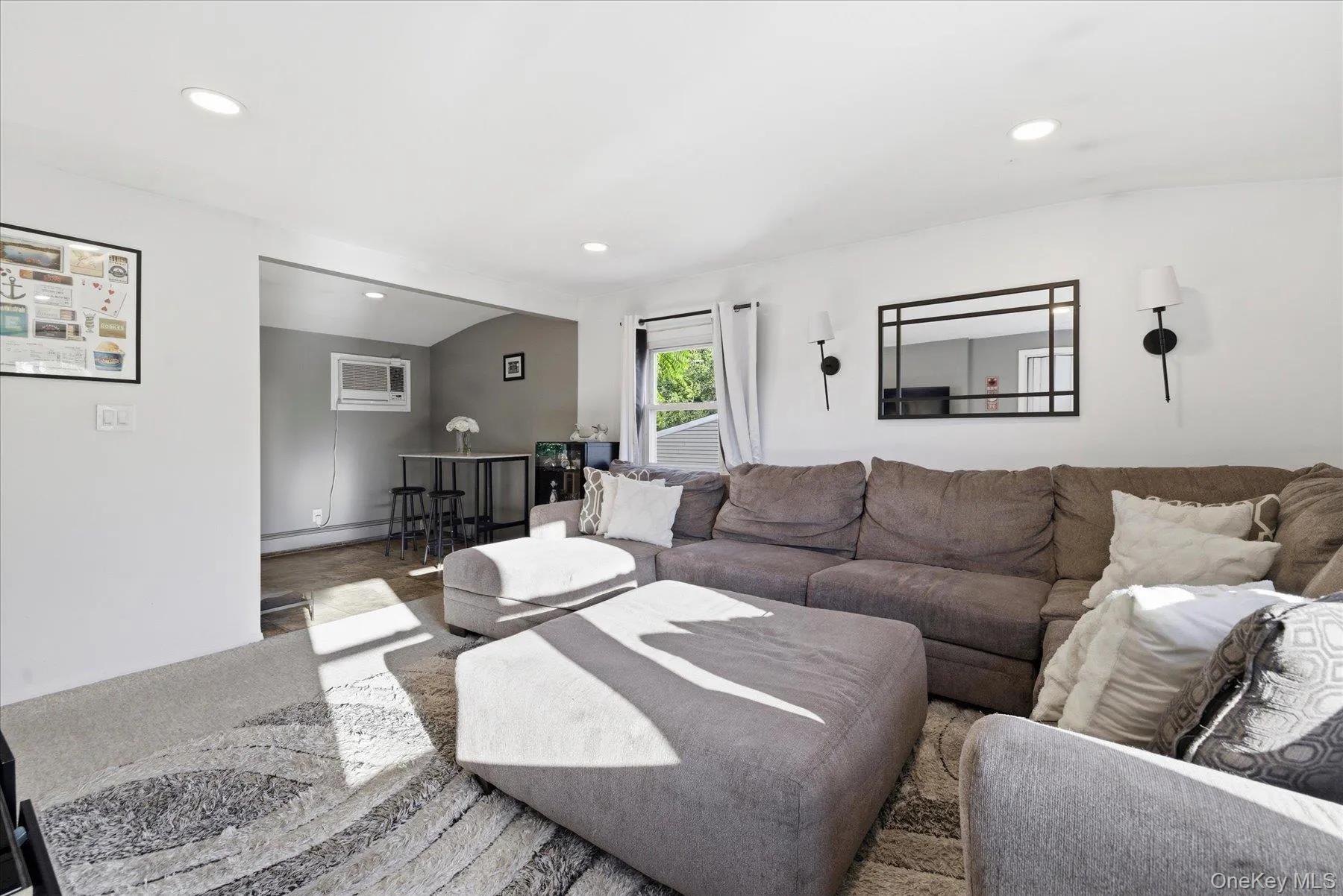 Bright living area featuring recessed lighting Bright living area featuring recessed lighting