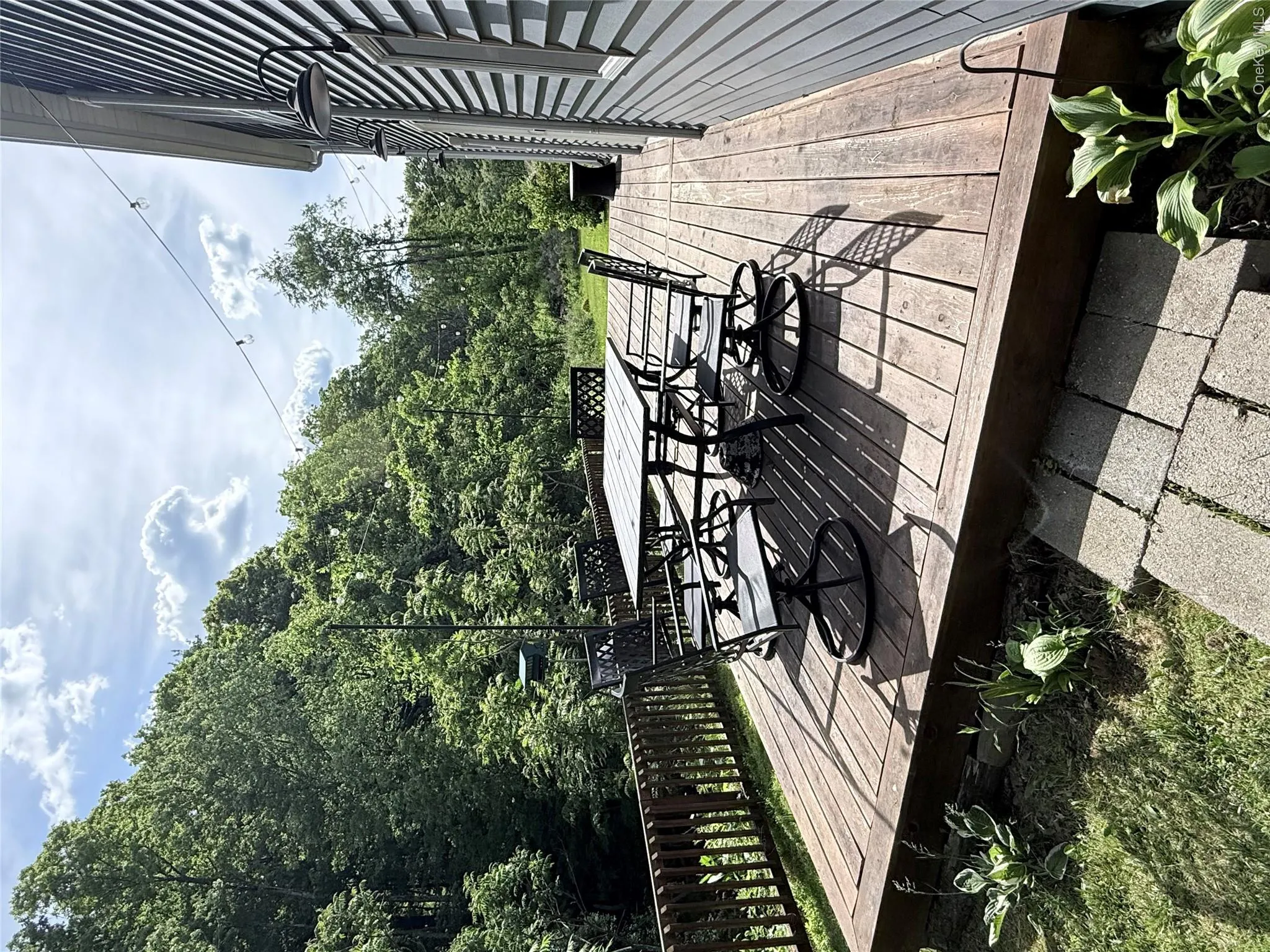 Expansive wood deck with a perimeter railing Expansive wood deck with a perimeter railing