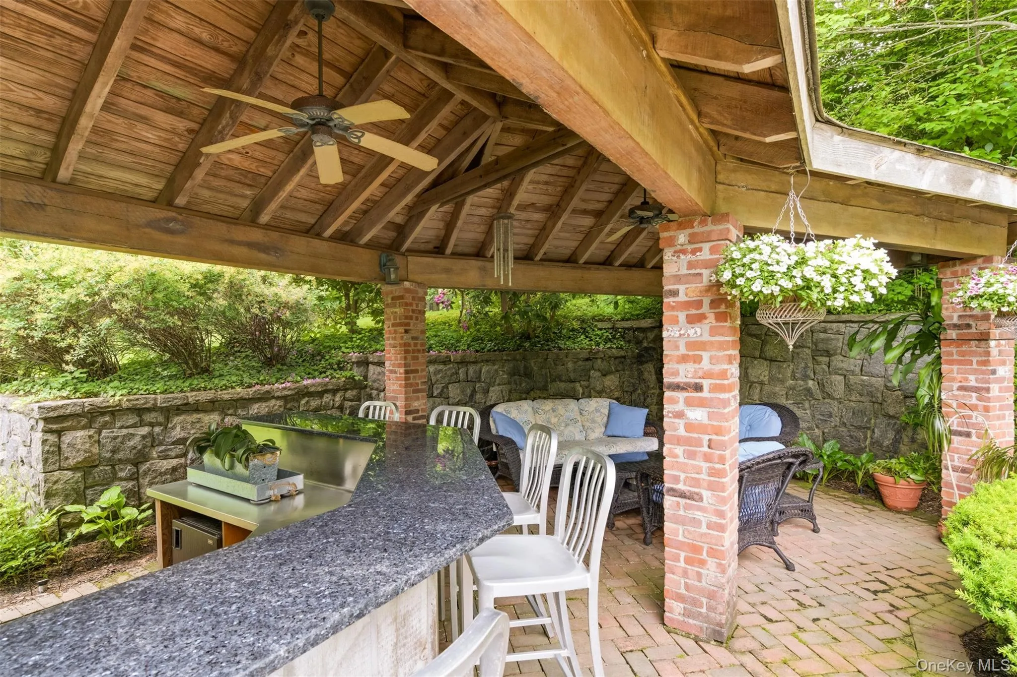 Pool cabana w/ bar, seating area, sink, refrigerator, bathroom & outdoor shower Pool cabana w/ bar, seating area, sink, refrigerator, bathroom & outdoor shower