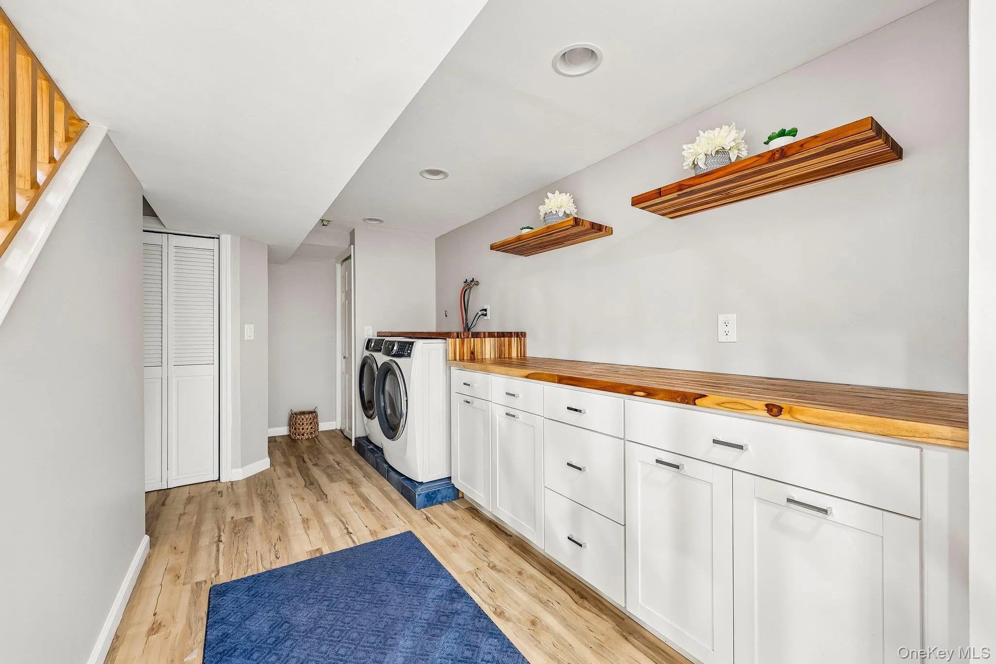 Custom laundry room in basement level Custom laundry room in basement level