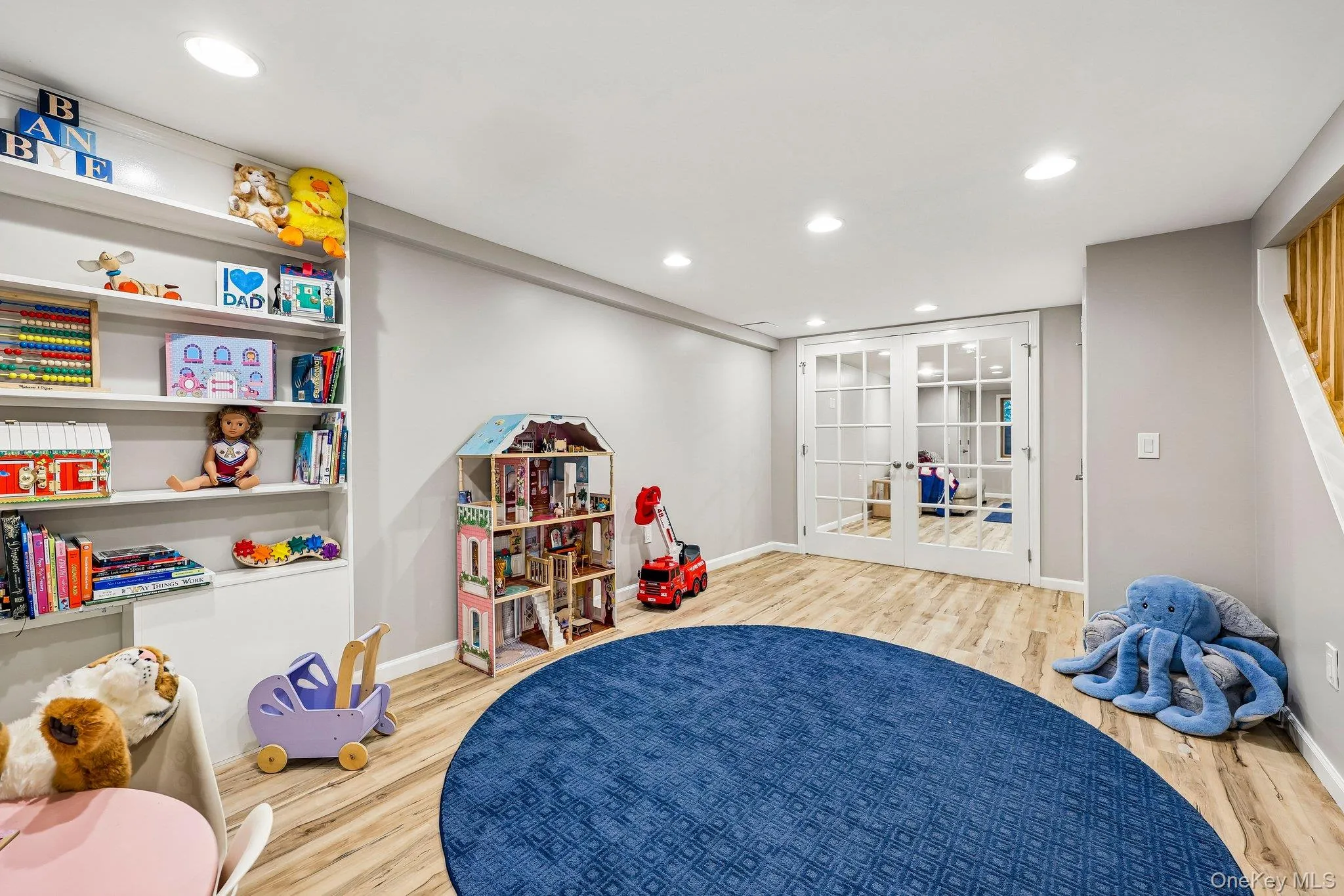 Currently this is a playroom. French doors lead to family room Currently this is a playroom. French doors lead to family room