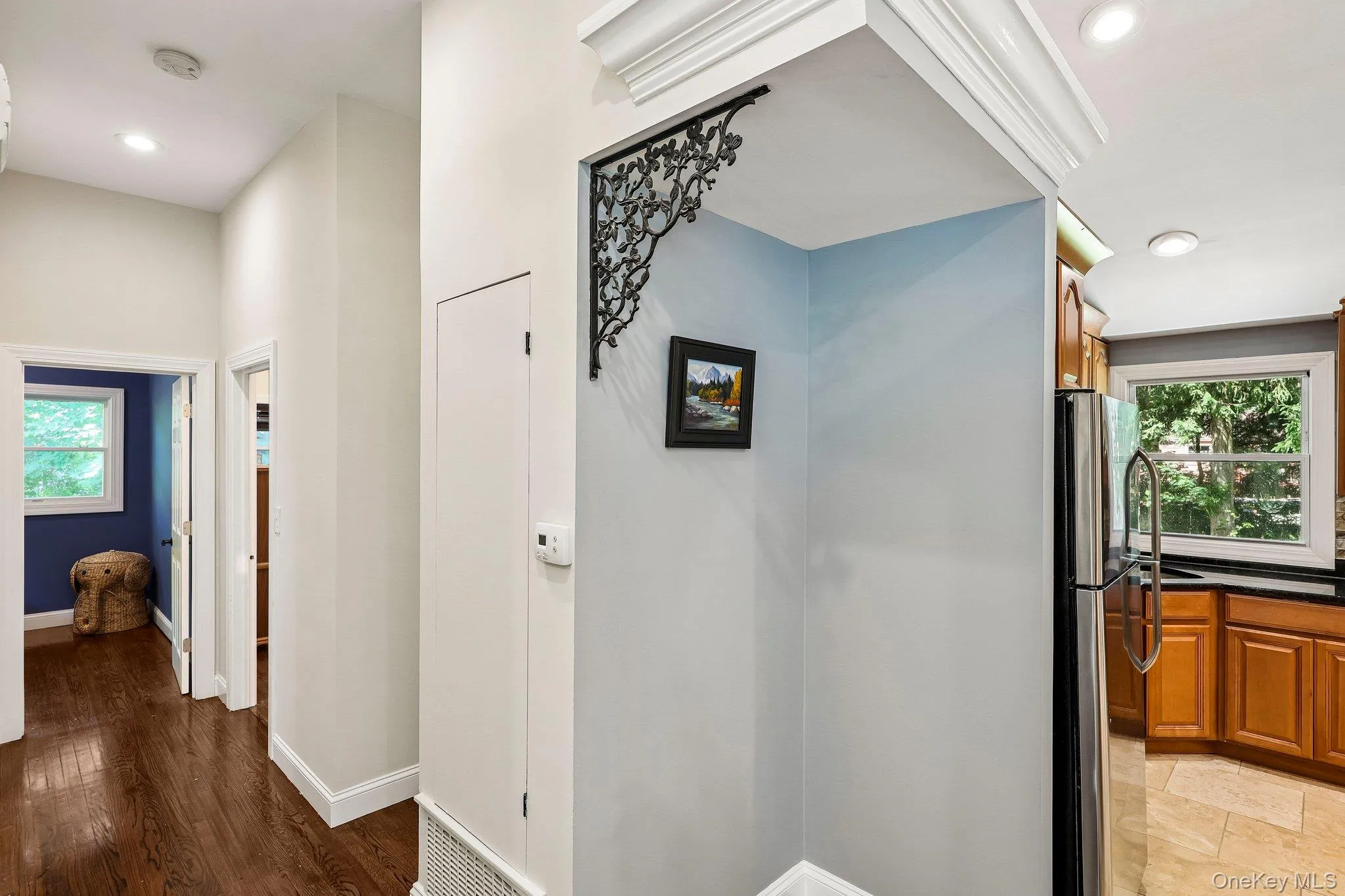View towards bedrooms and bath. Decorative corbels and crown molding accent the open space View towards bedrooms and bath. Decorative corbels and crown molding accent the open space