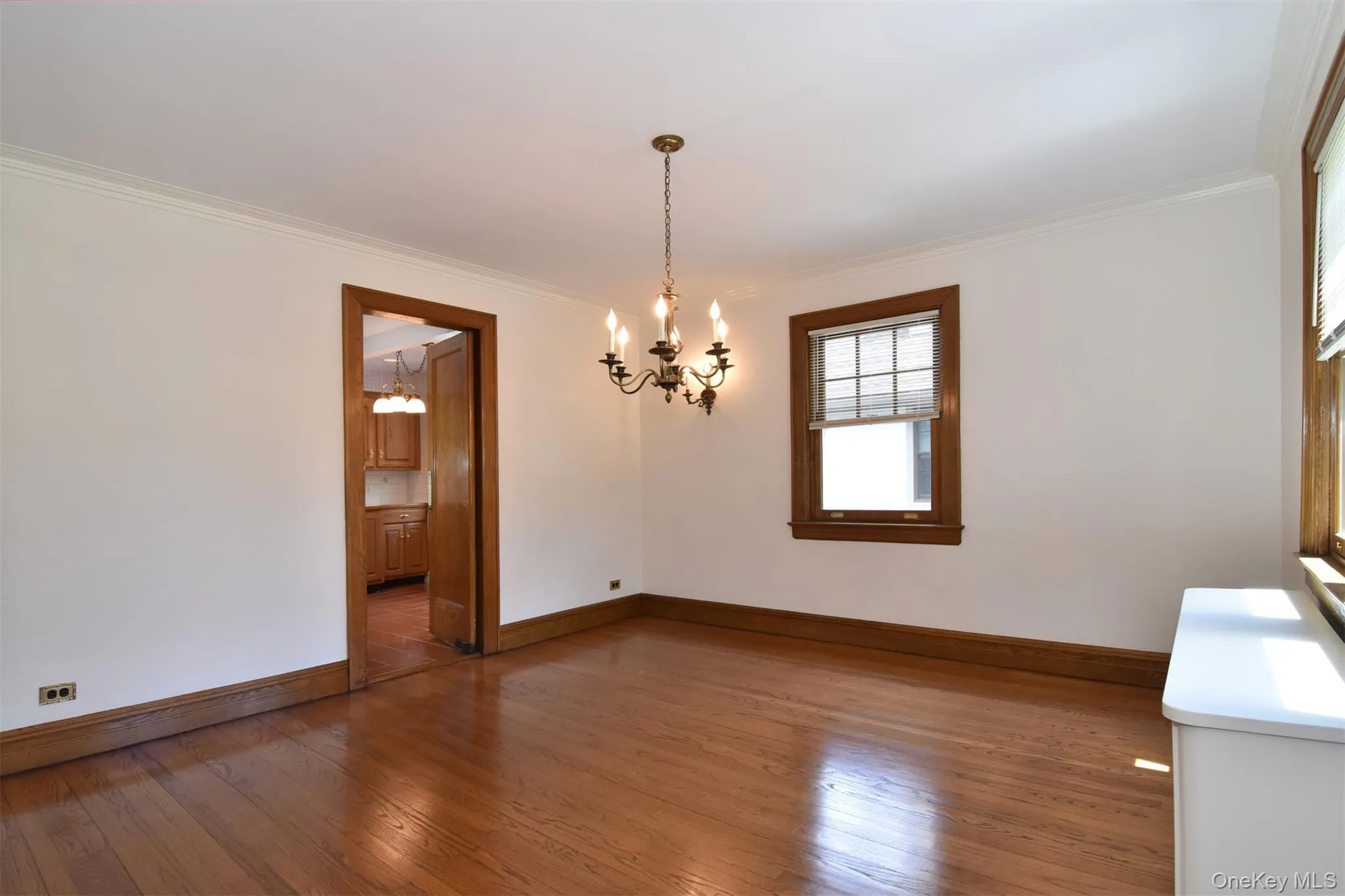 Formal dining room with view to kitchen Formal dining room with view to kitchen
