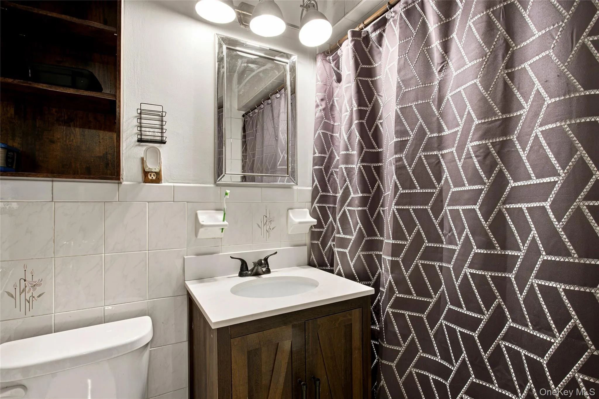 Bathroom features a new vanity and step-in shower offering everyday convenience. Bathroom features a new vanity and step-in shower offering everyday convenience.