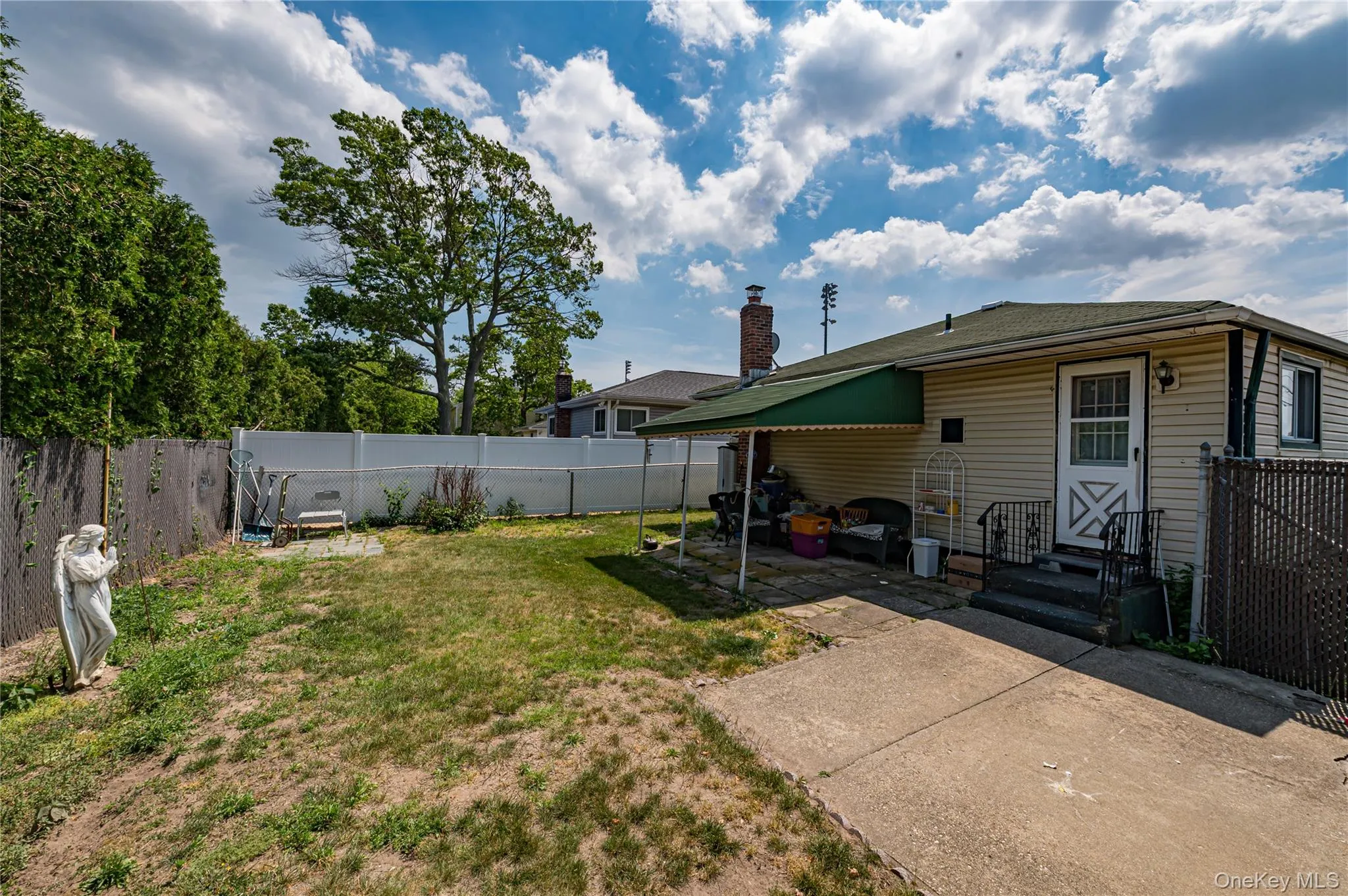 Rear view has overhang over patio Rear view has overhang over patio