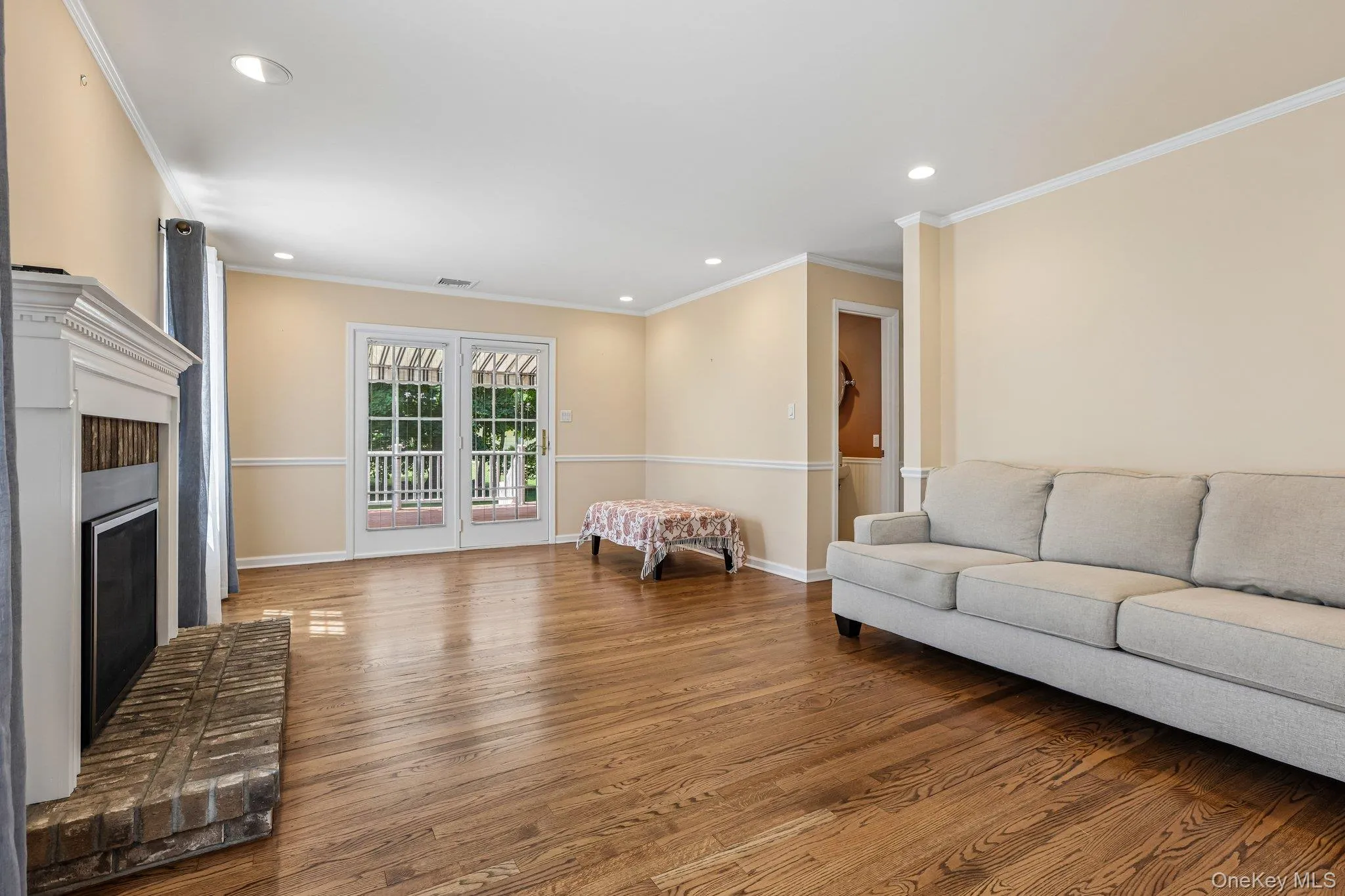 Family room. Doors in view open to back deck Family room. Doors in view open to back deck