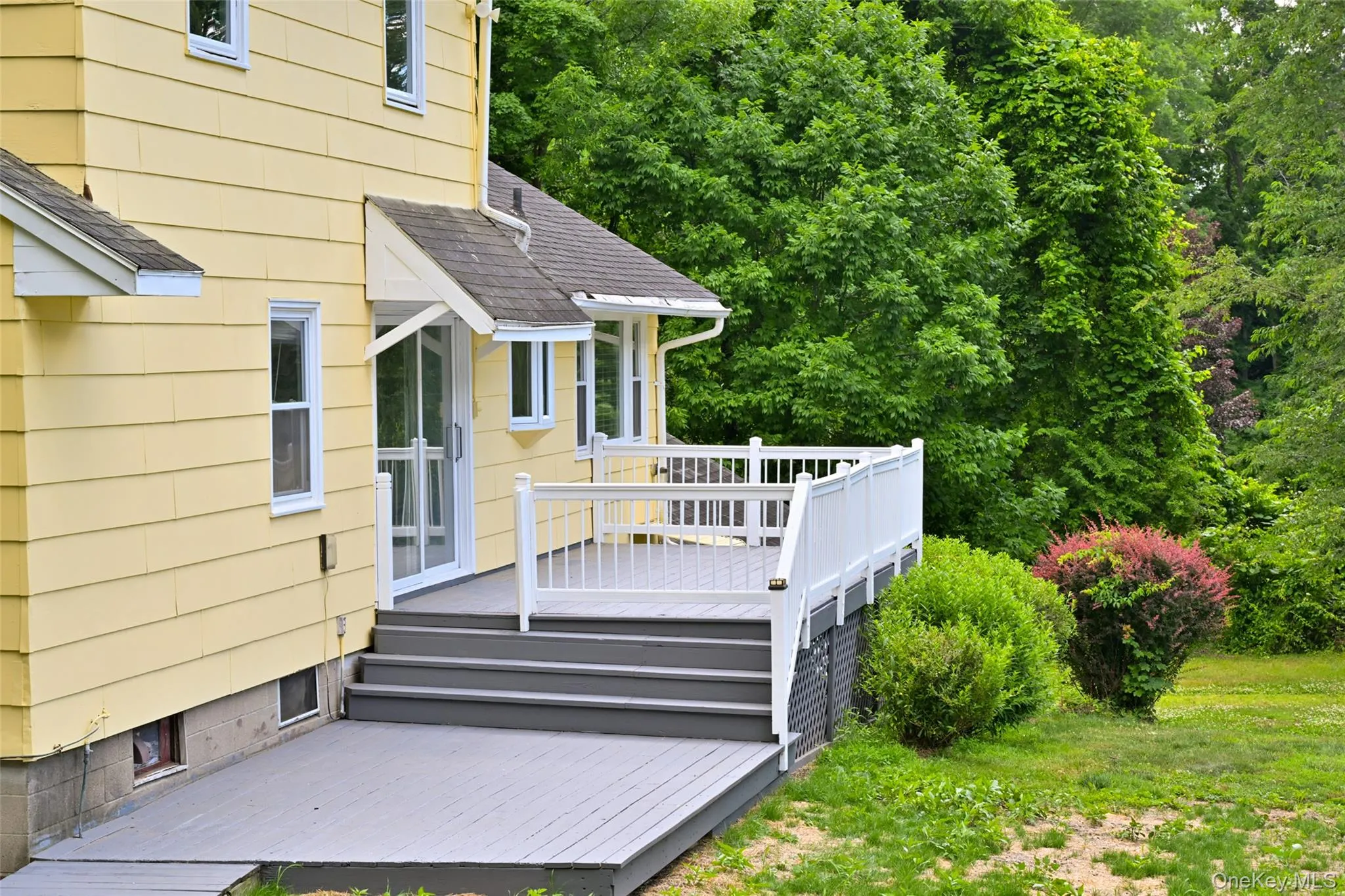 Back of structure access to kitchen/ deck/backyard Back of structure access to kitchen/ deck/backyard