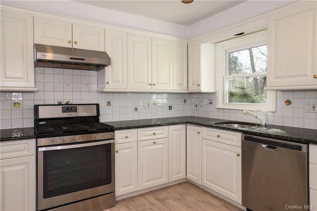 Kitchen with wood cabinetry Kitchen with wood cabinetry