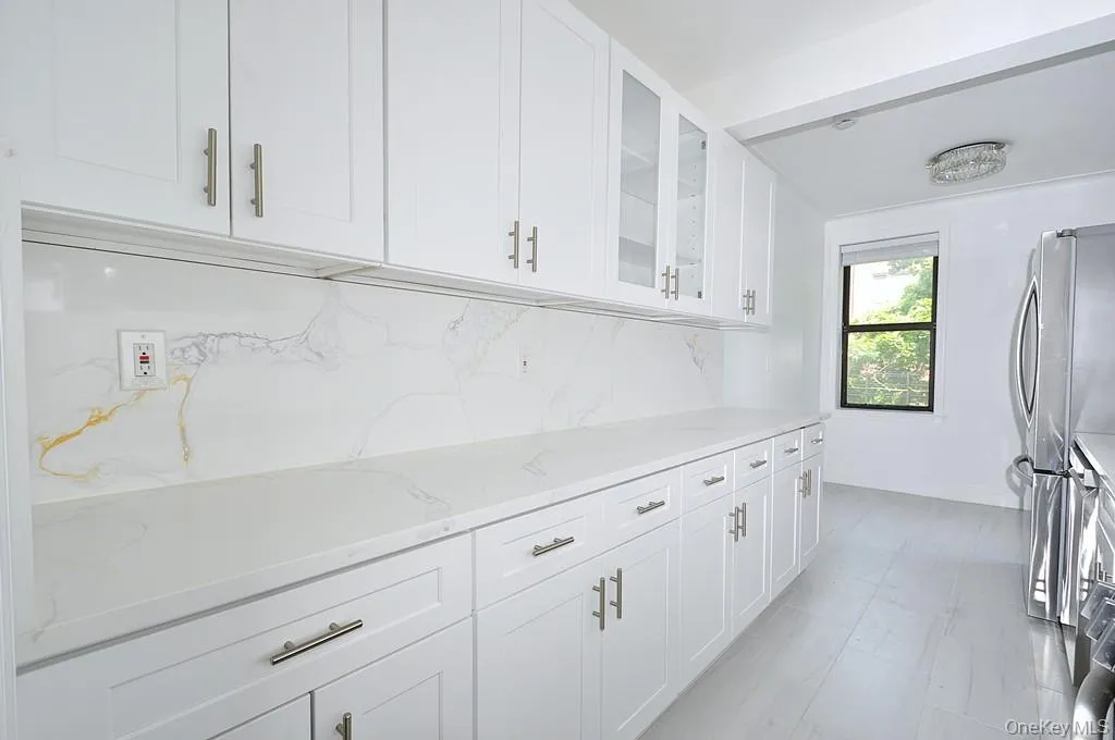 Renovated eat-in-kitchen with stainless steel appliances and quartz counters. Renovated eat-in-kitchen with stainless steel appliances and quartz counters.