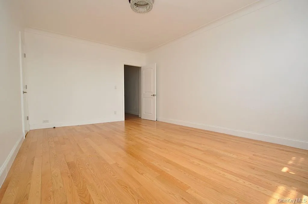 Bedroom with walk-in closet and refinished hardwood floors. The bedroom is approx. 16'-2" x 11'-11". Bedroom with walk-in closet and refinished hardwood floors. The bedroom is approx. 16'-2" x 11'-11".