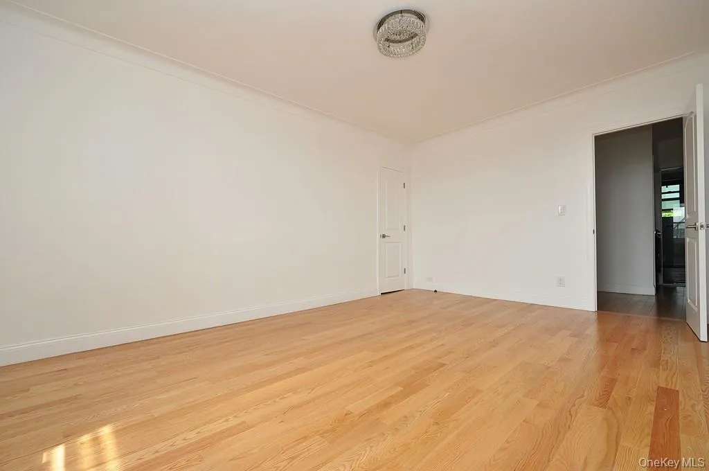 Bedroom with walk-in closet and refinished hardwood floors. The bedroom is approx. 16'-2" x 11'-11". Bedroom with walk-in closet and refinished hardwood floors. The bedroom is approx. 16'-2" x 11'-11".