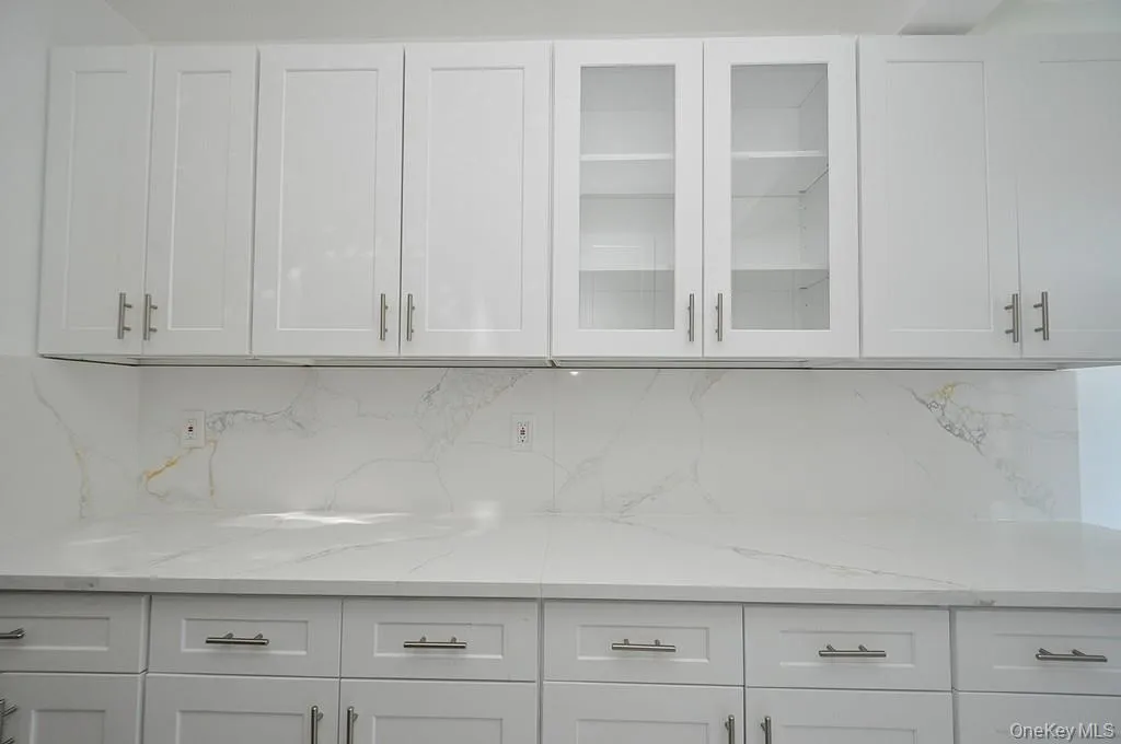 Renovated eat-in-kitchen with stainless steel appliances and quartz counters. Renovated eat-in-kitchen with stainless steel appliances and quartz counters.