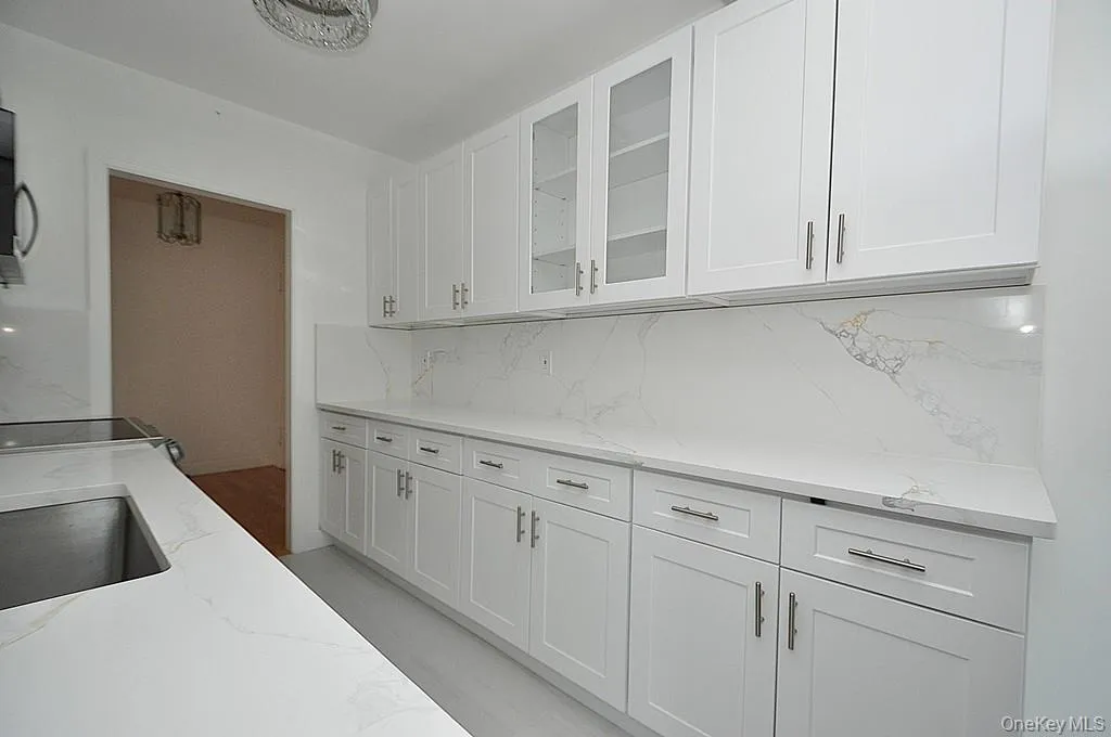 Renovated eat-in-kitchen with stainless steel appliances and quartz counters. Renovated eat-in-kitchen with stainless steel appliances and quartz counters.