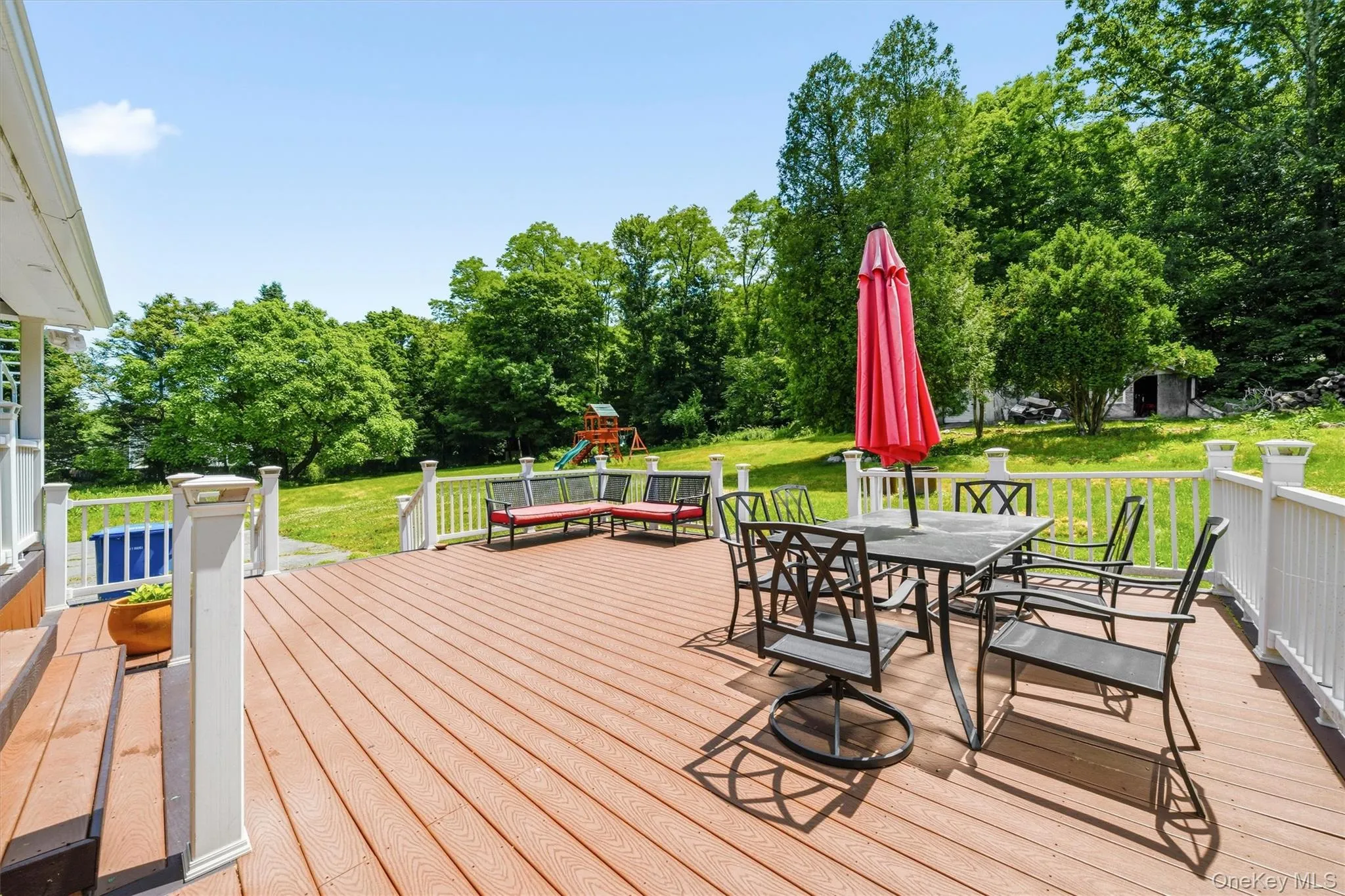 Massive outdoor entertaining space off the covered wraparound deck! Massive outdoor entertaining space off the covered wraparound deck!