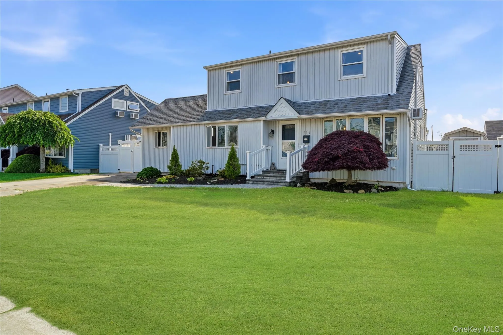 Front of home with wide driveway. Front of home with wide driveway.