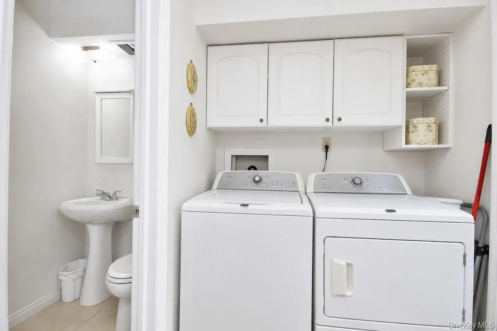 Laundry area off kitchen and half bath Laundry area off kitchen and half bath