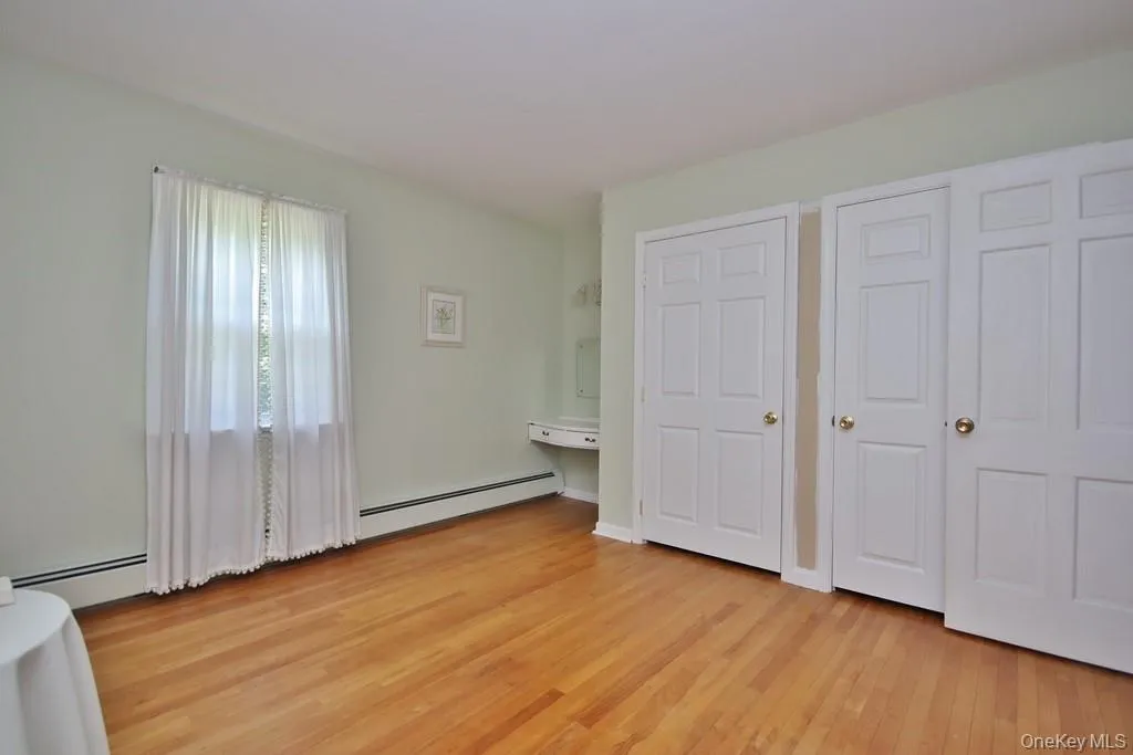 Bedroom #1 with hardwood floors and large closets Bedroom #1 with hardwood floors and large closets