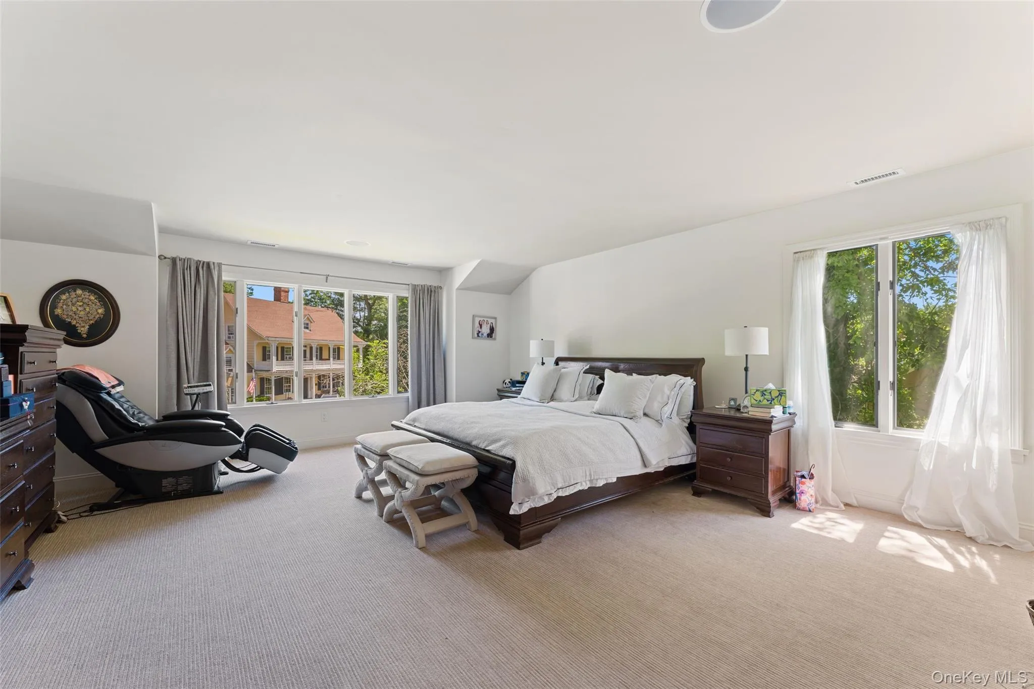 Oversized primary bedroom suite with large closets and a private ensuite bathroom Oversized primary bedroom suite with large closets and a private ensuite bathroom