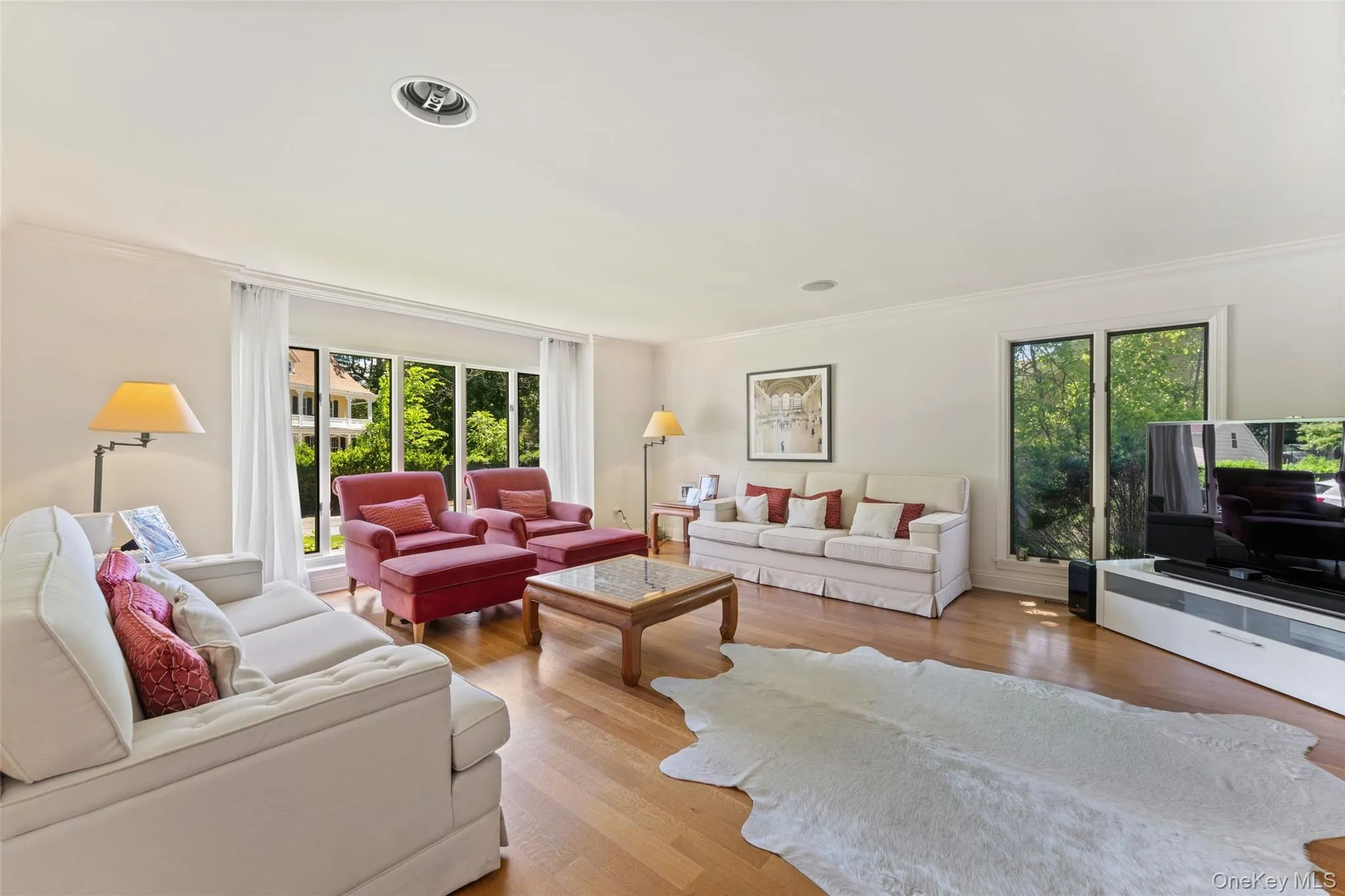Sun filled living room with large windows Sun filled living room with large windows