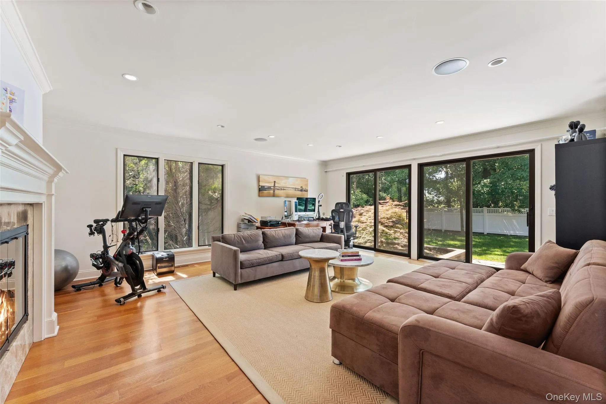 Den with large sliding doors providing access to the backyard Den with large sliding doors providing access to the backyard