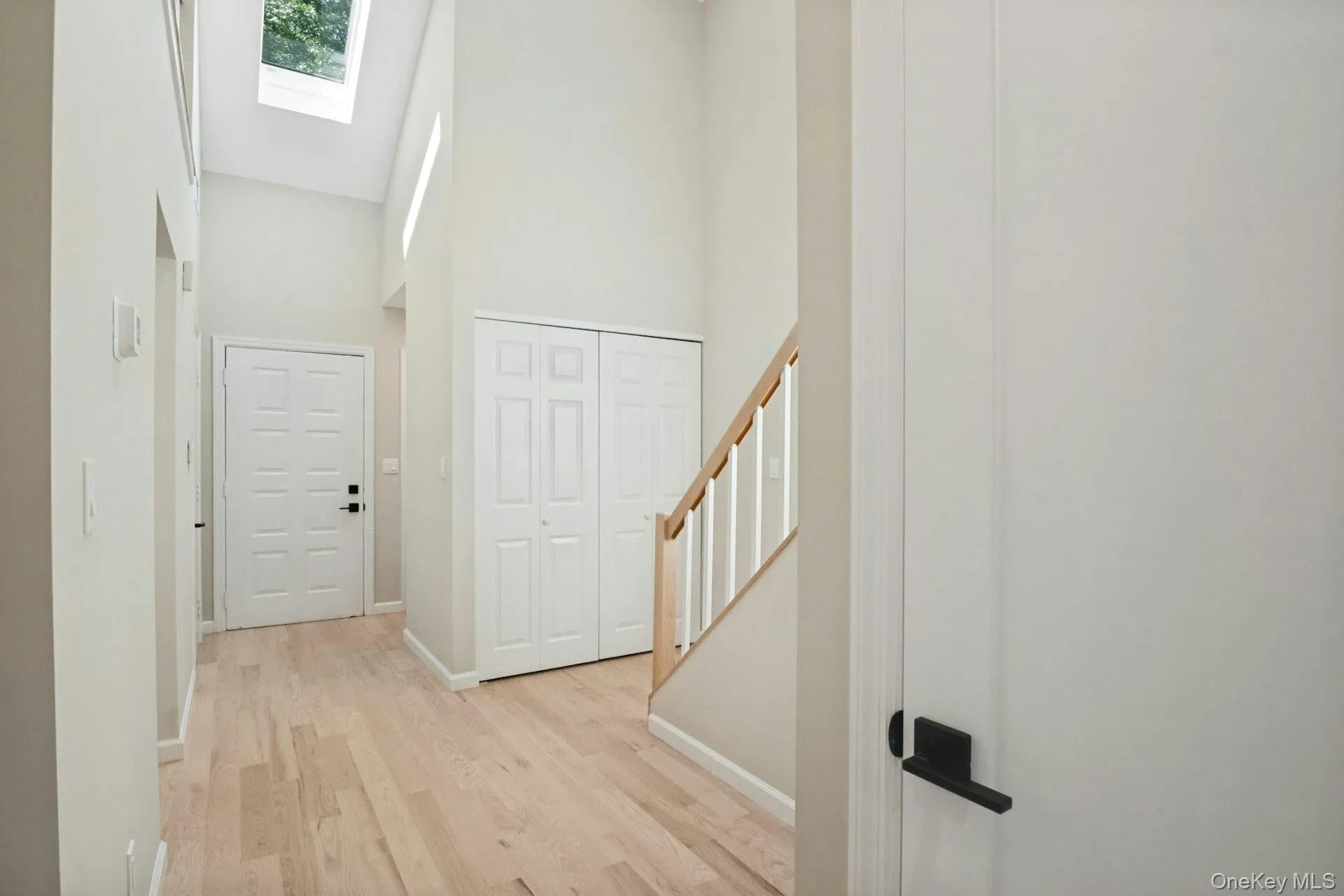 Entrance with sky light and open floor plan. Entrance with sky light and open floor plan.