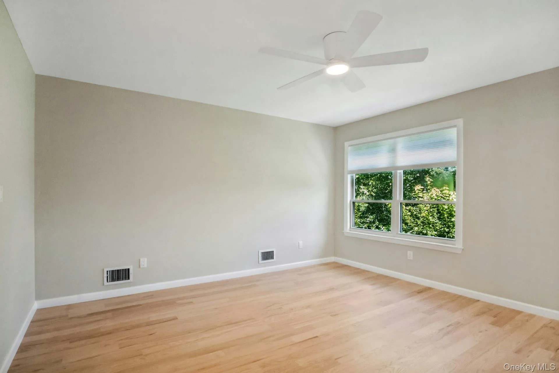 Large sun filled bedroom with hardwood floors. Large sun filled bedroom with hardwood floors.