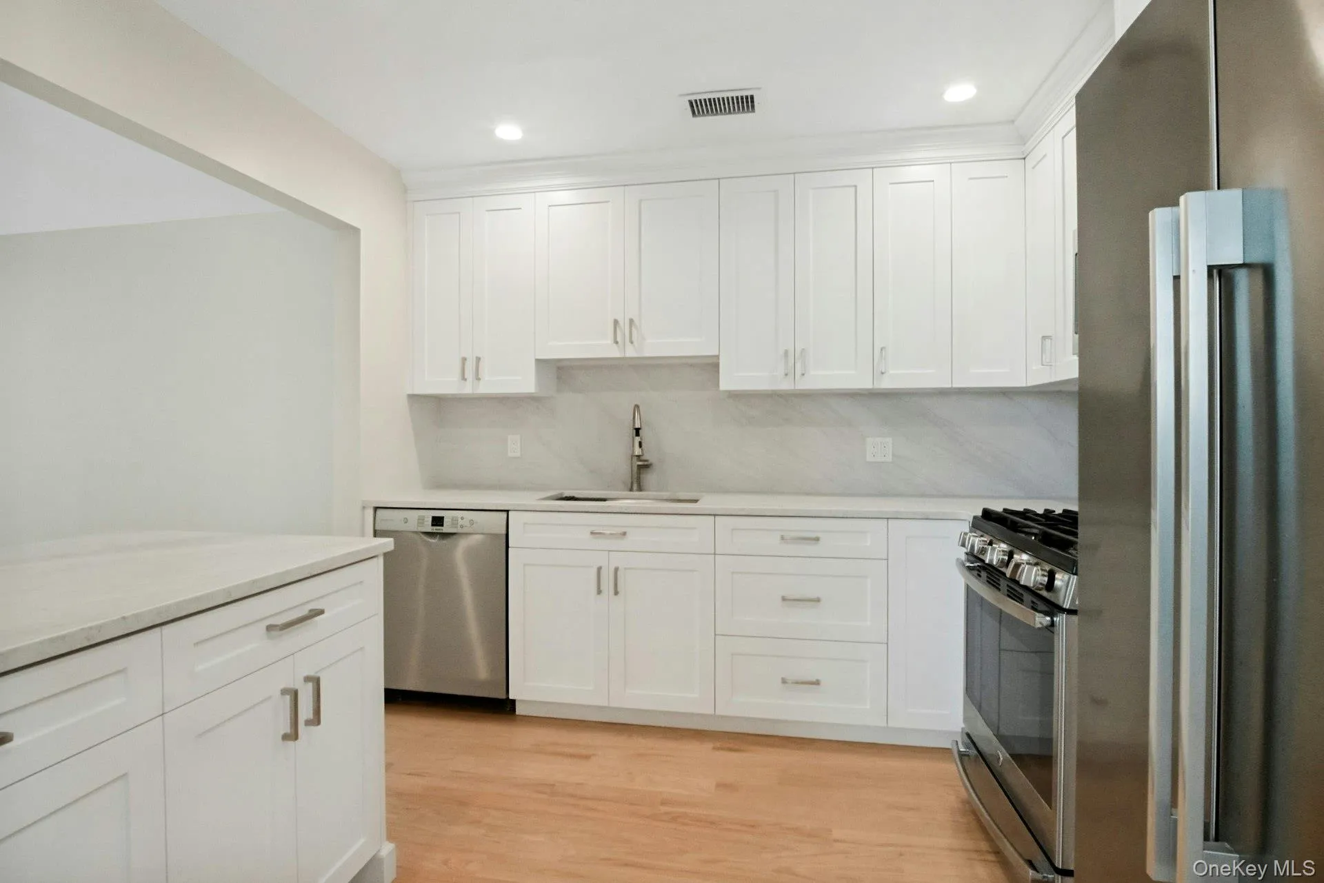 New kitchen with hardwood floors. New kitchen with hardwood floors.