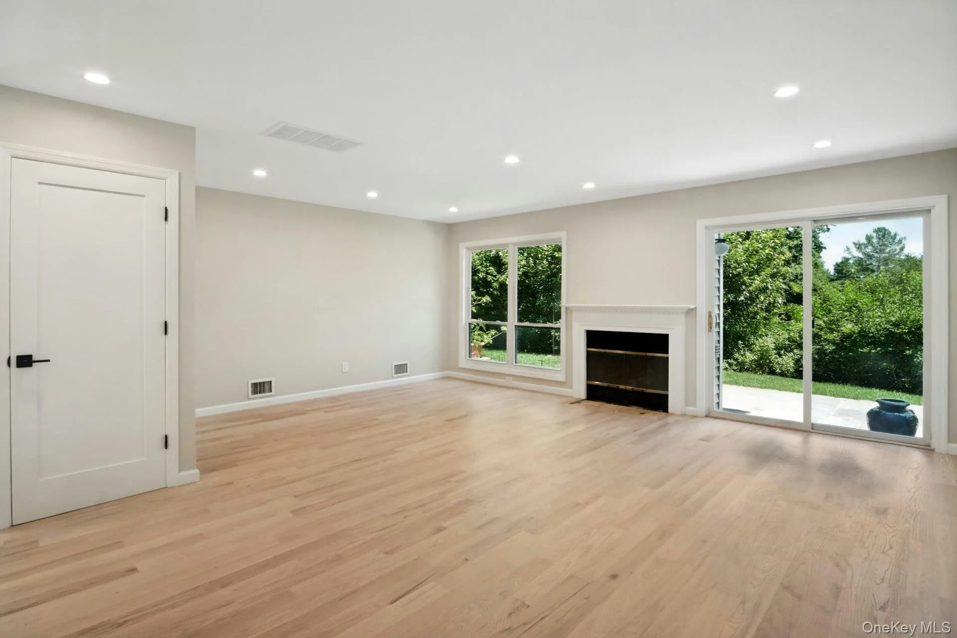 Hardwood floors and sliding door to deck. Hardwood floors and sliding door to deck.