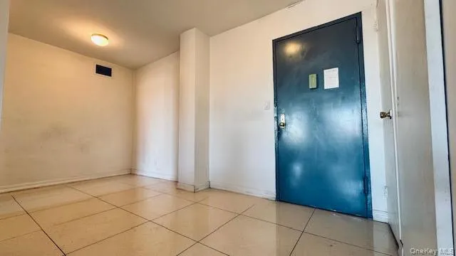 Entrance foyer with baseboards and light tile patterned floors Entrance foyer with baseboards and light tile patterned floors