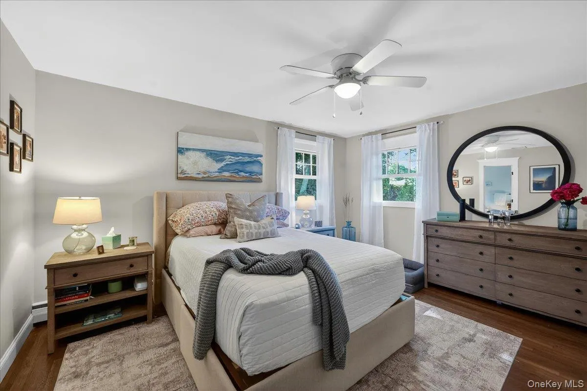Hardwood-style flooring extends throughout this room, complemented by neutral wall tones Hardwood-style flooring extends throughout this room, complemented by neutral wall tones